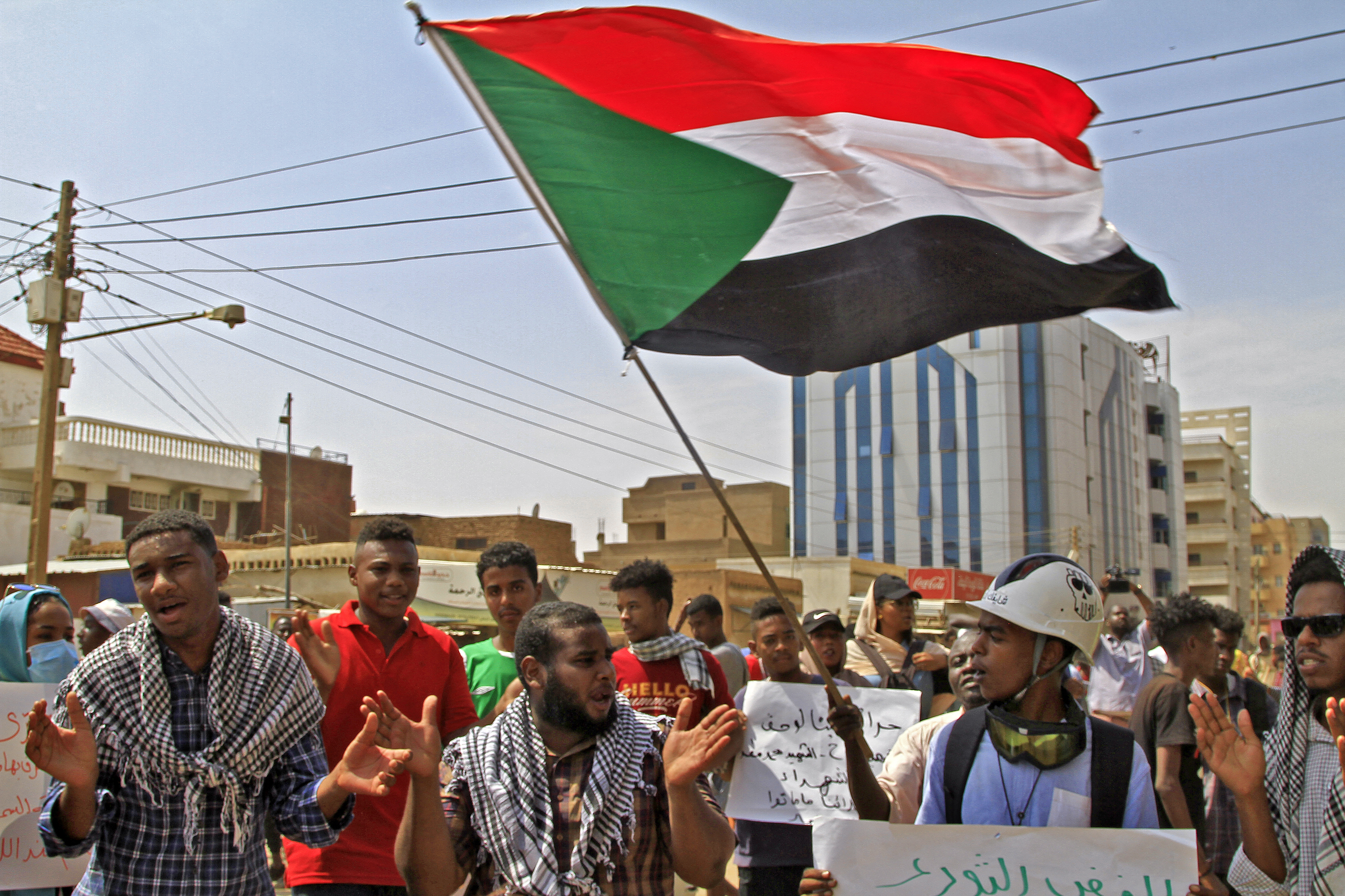 Sudan protesters waving flag