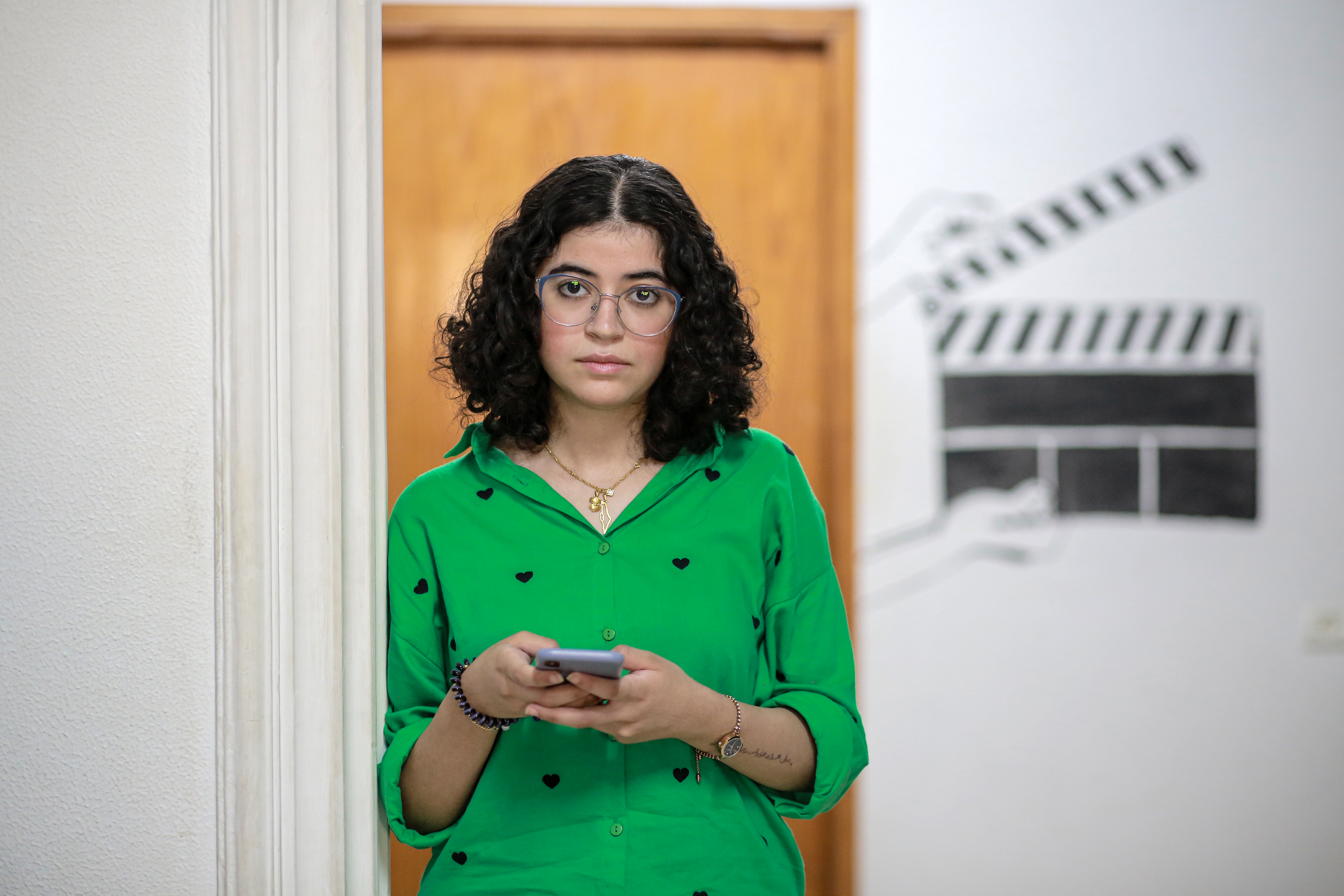 A lady holds her mobile