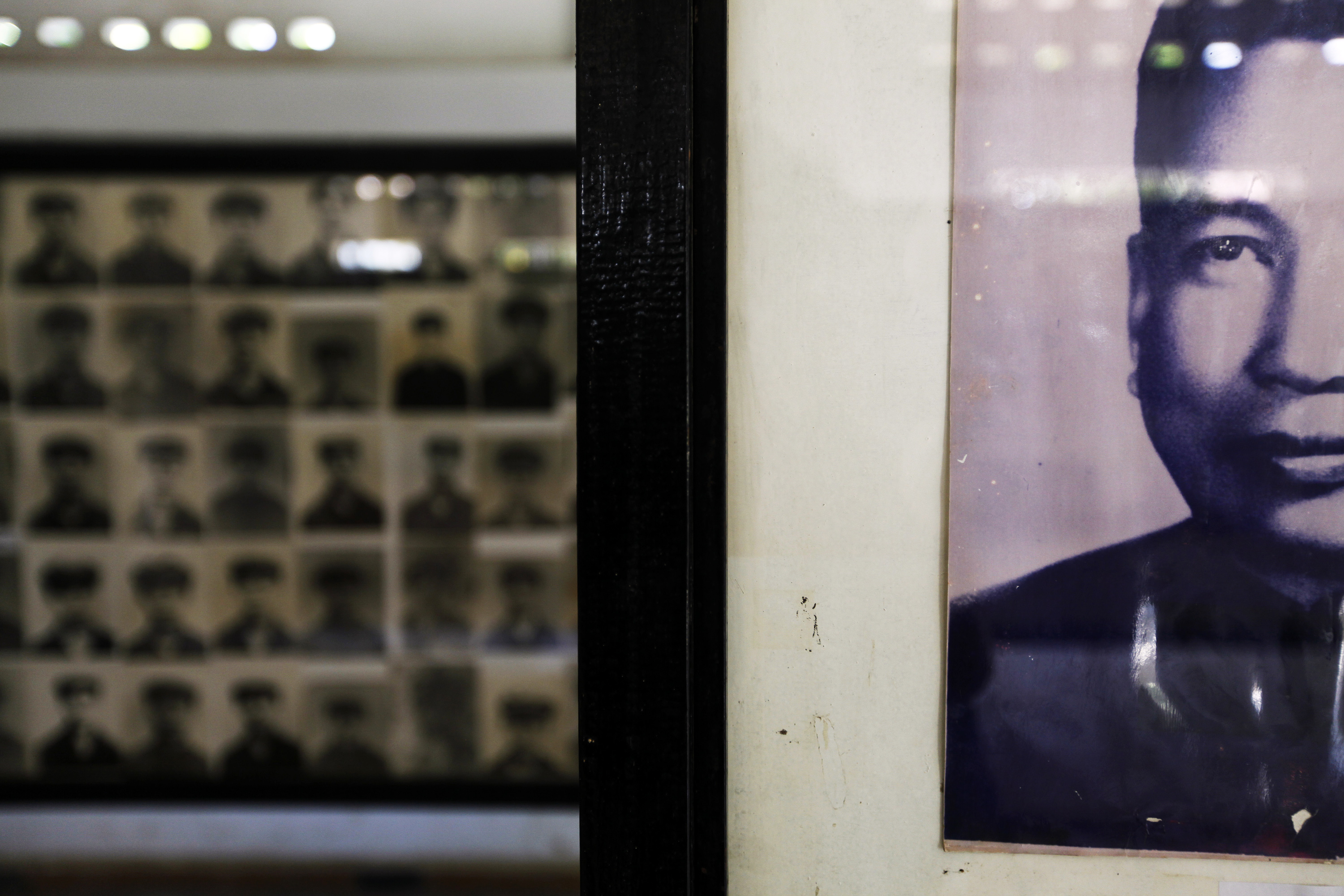 A portrait of of Khmer Rouge leader and "Brother Number One" Pol Pot is seen in front of pictures of his victims at the Tuol Sleng Genocide Museum in Phnom Penh, Cambodia.