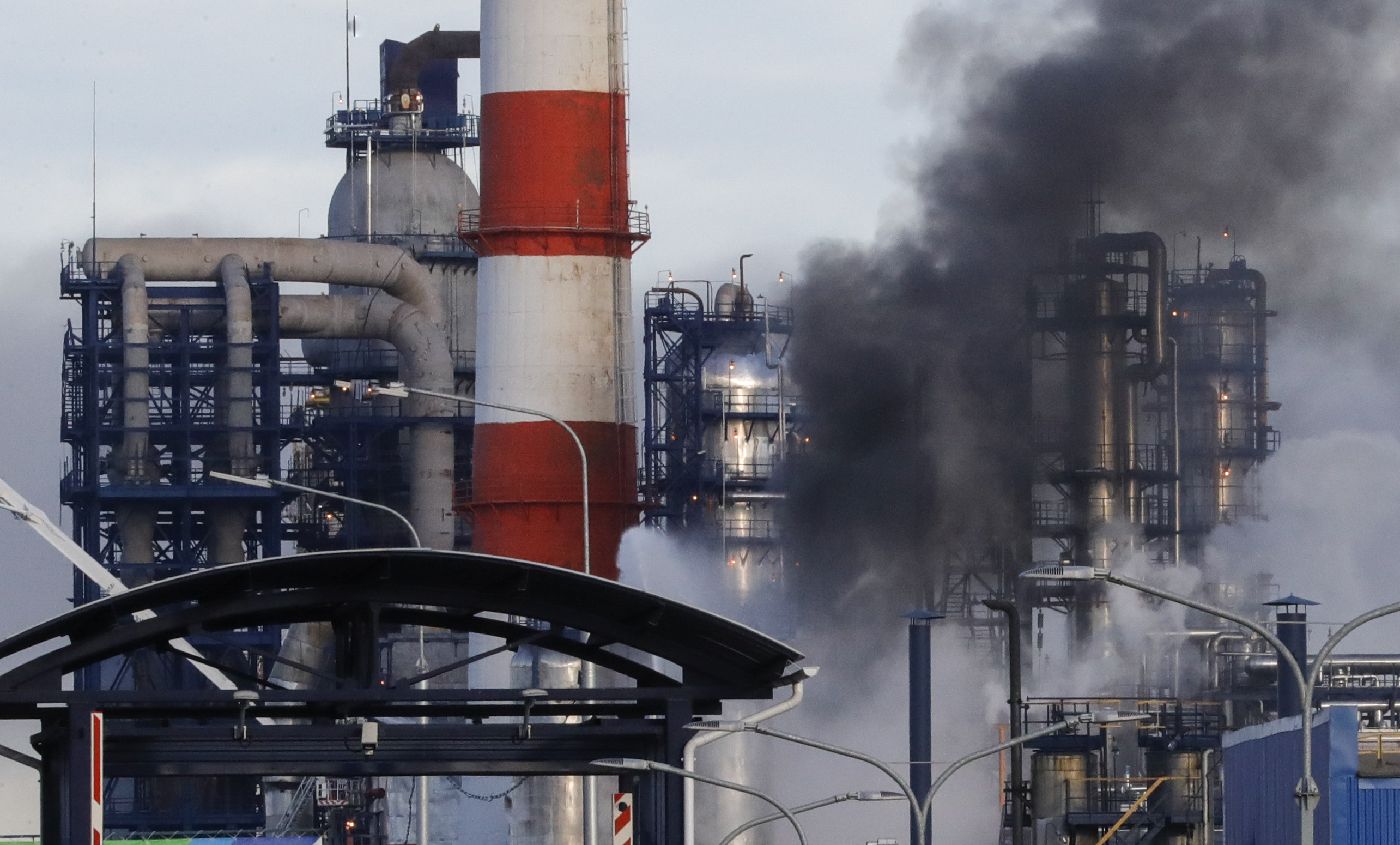 Smoke billows from a fire at oil refinery, owned by Russian oil producer Gazprom Neft, in Moscow, Russia
