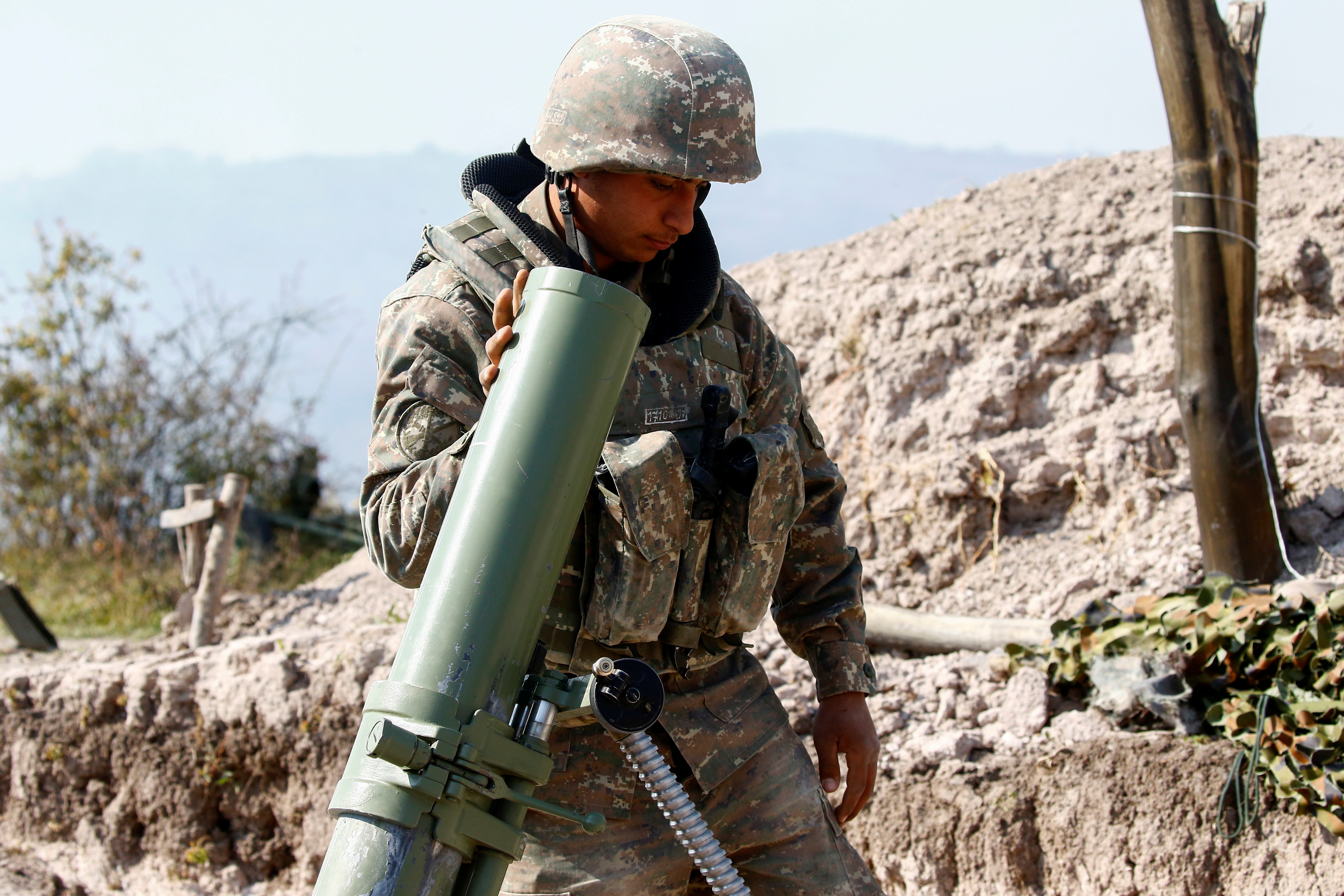 An Armenian soldier is seen crewing a frontline position in Nagorno-Karabakh