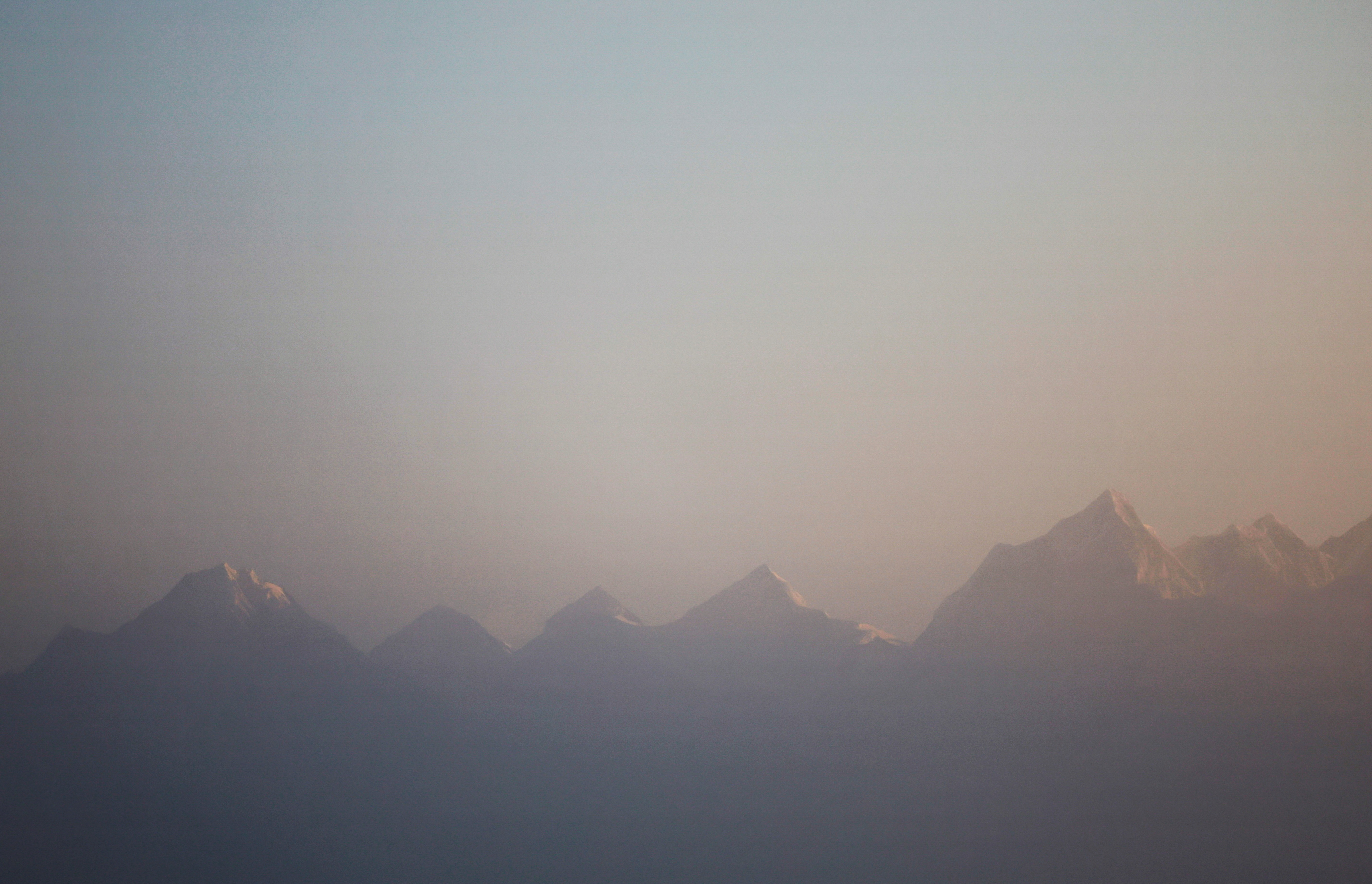 Mount Everest, the world highest peak, and other peaks of the Himalayan range are seen during the sunrise from Ratnange hill in Solukhumbu, Nepal March 27, 2022.