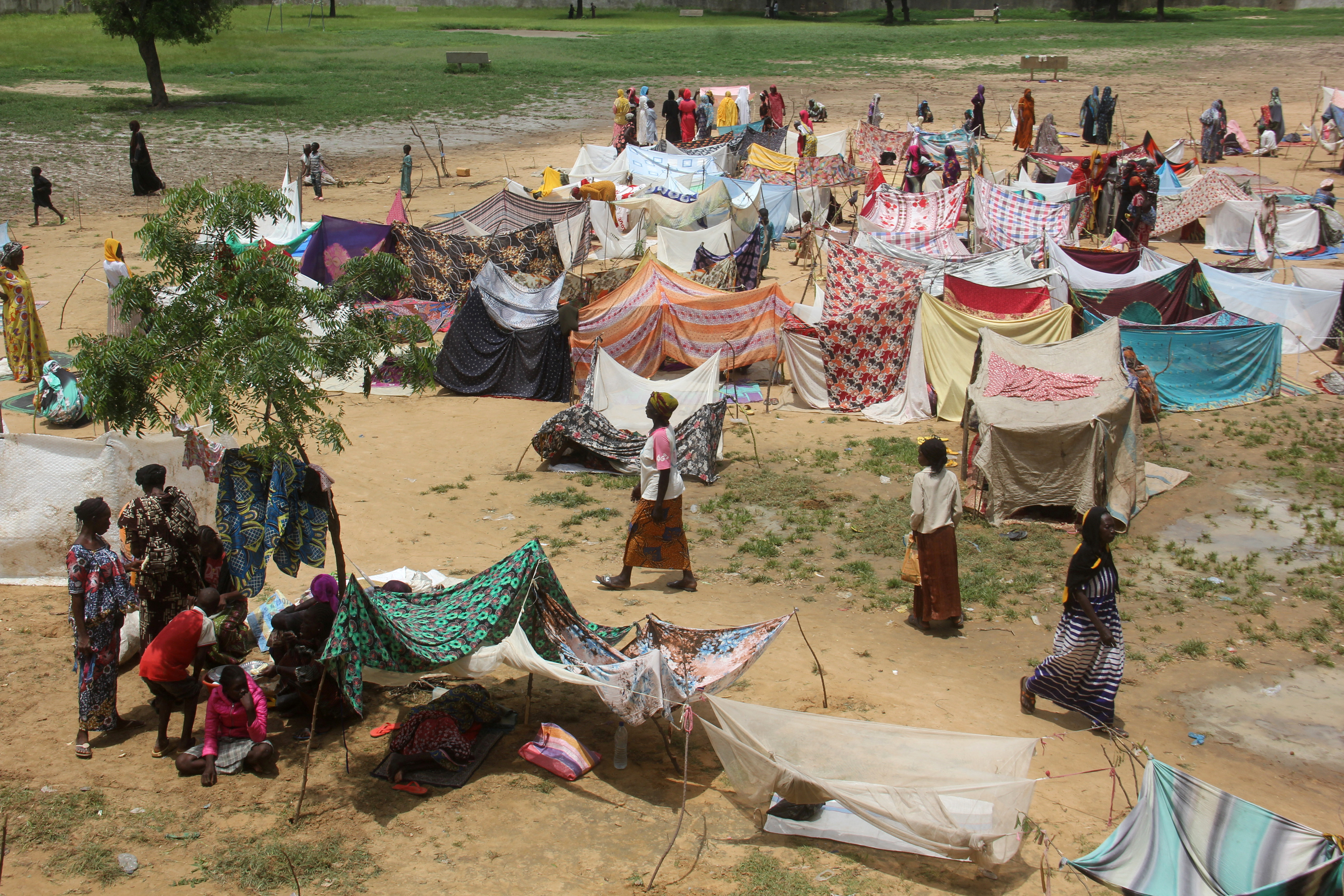 Flood victims set up makeshift shelters at a schoolyard where they take refuge after heavy rains, in Ndjamena, Chad