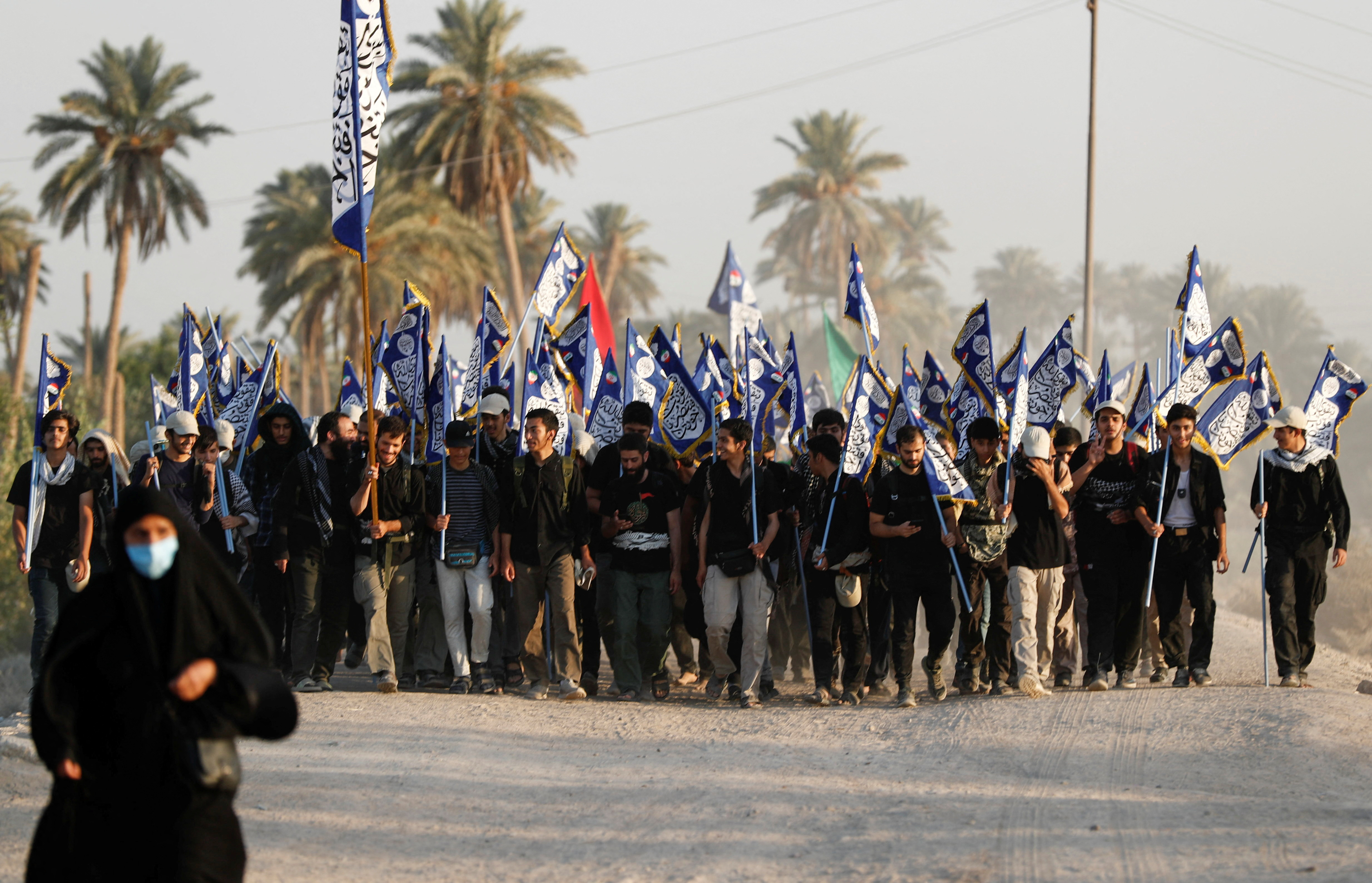 Shia Muslim pilgrims walk to the holy city of Kerbala