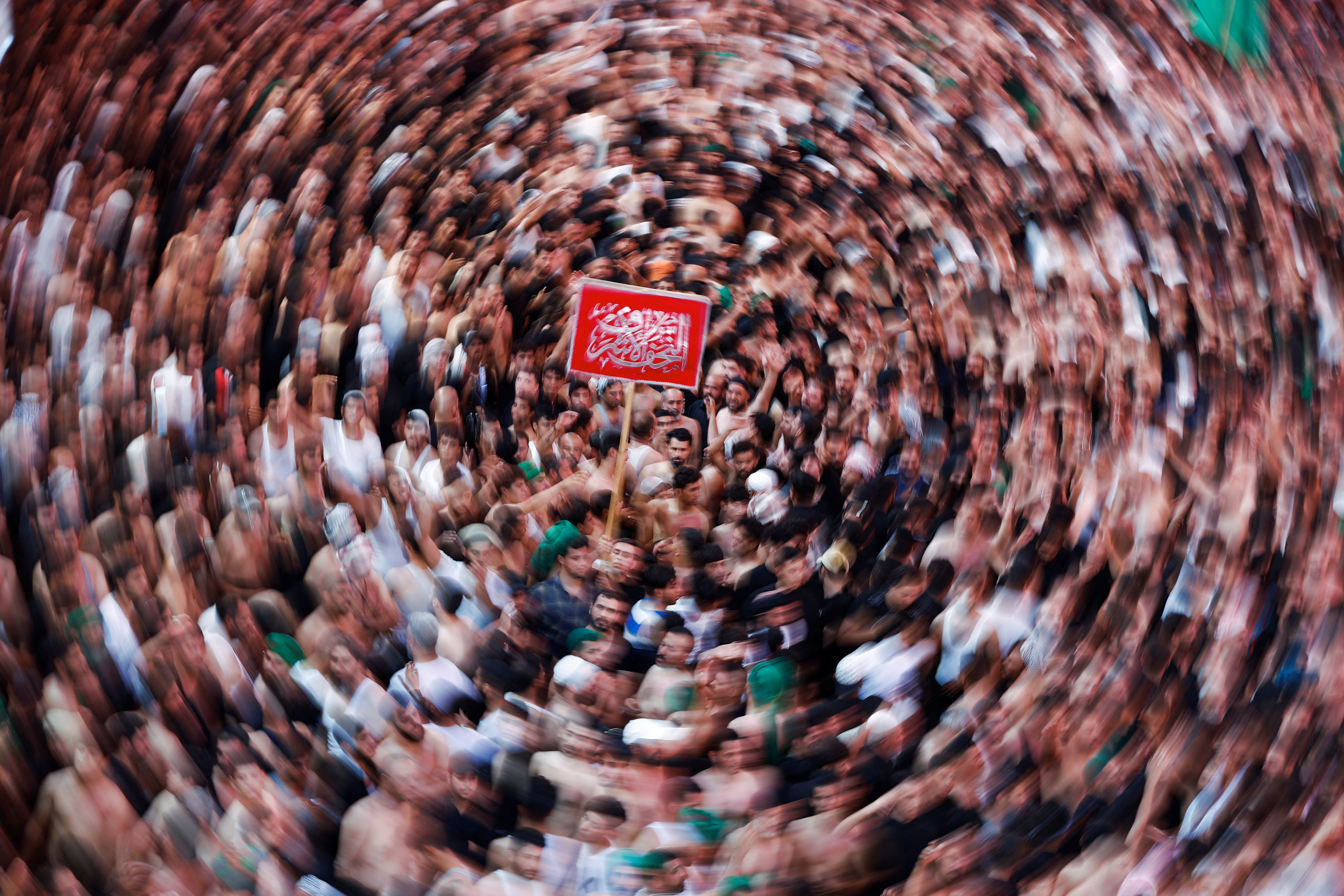Shia Muslim pilgrims take part in Arbaeen in the holy city of Kerbala.