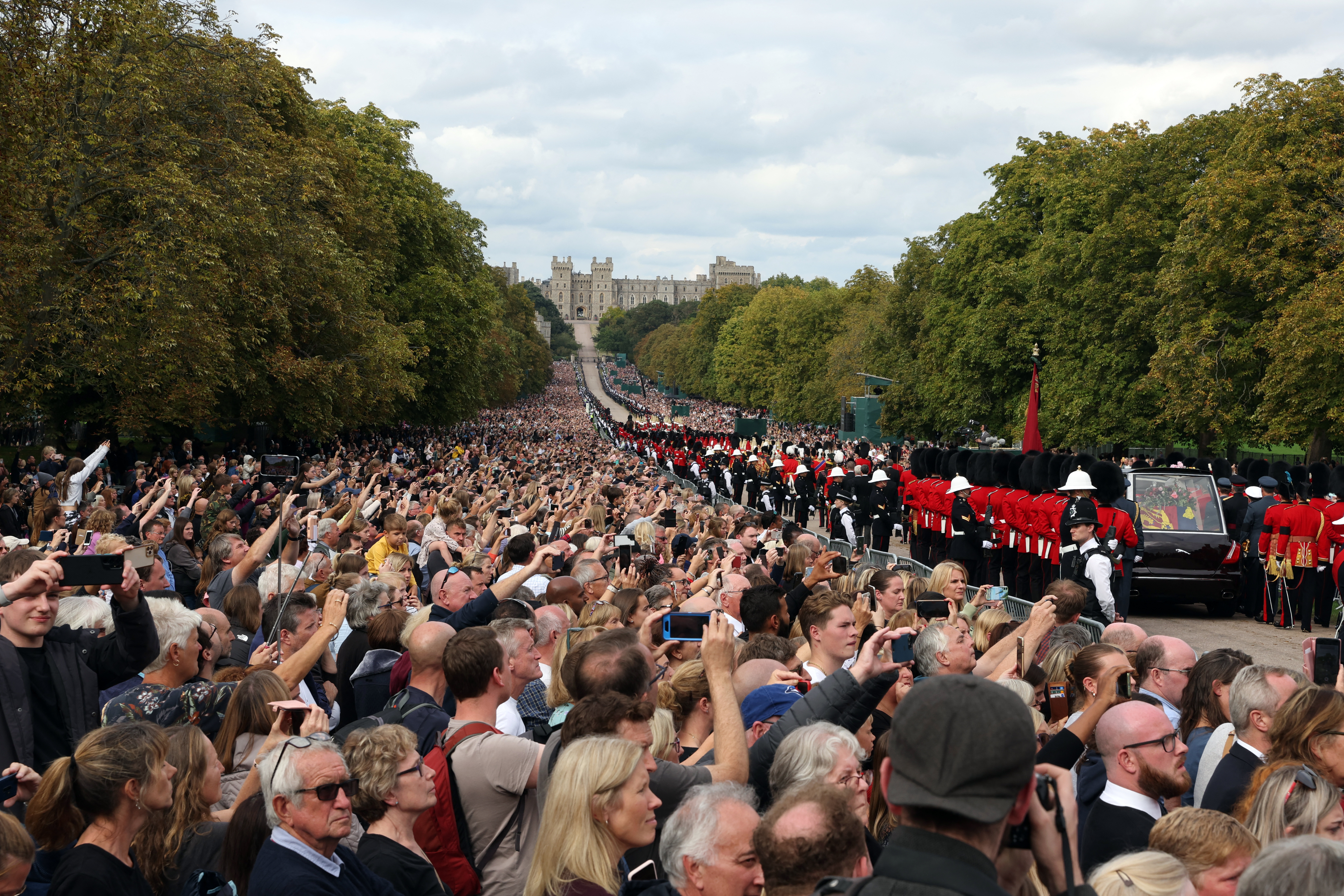 The hearse carrying the coffin.