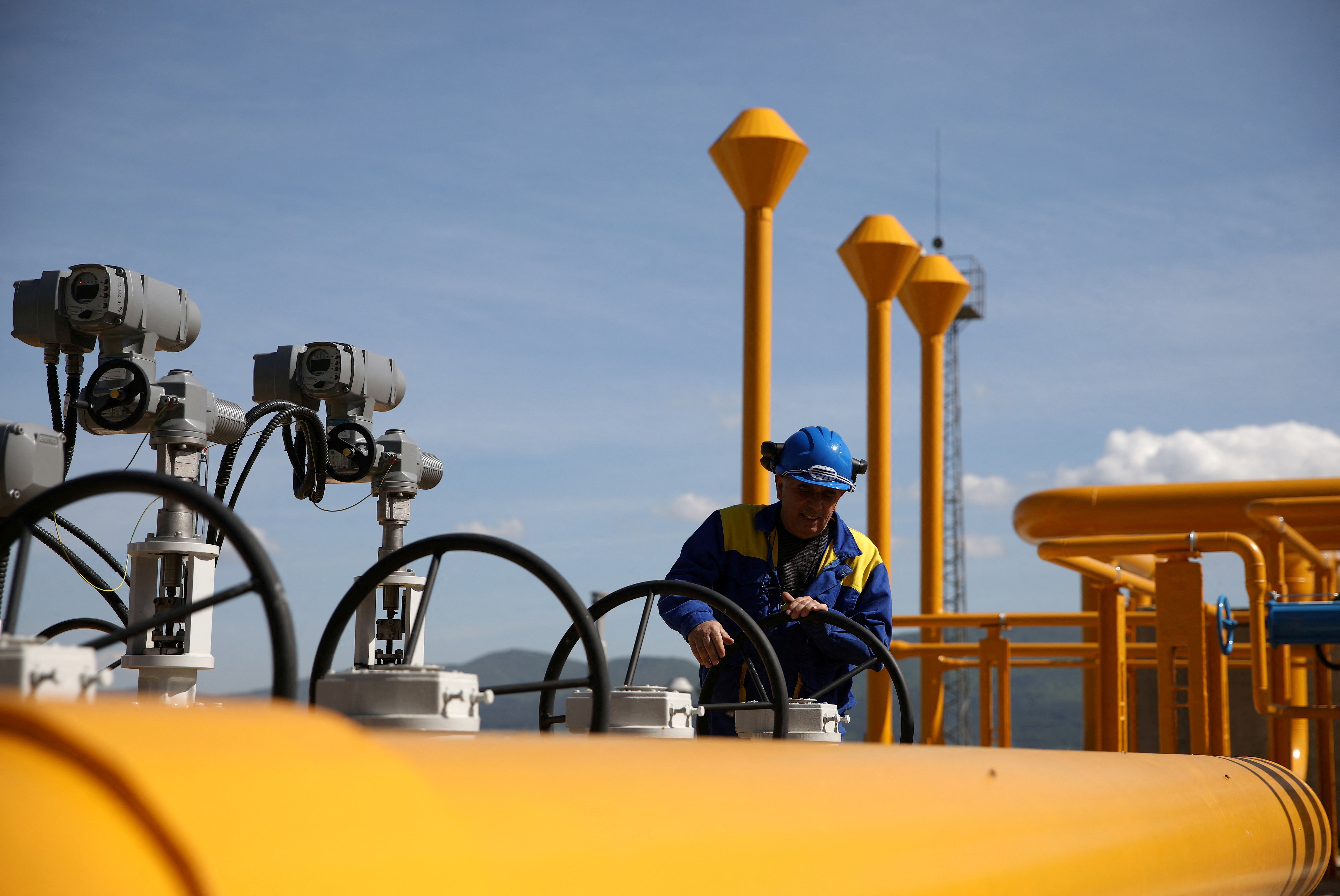 An employee works at Bulgartransgaz gas compressor station near Ihtiman, Bulgaria, May 12, 2022.