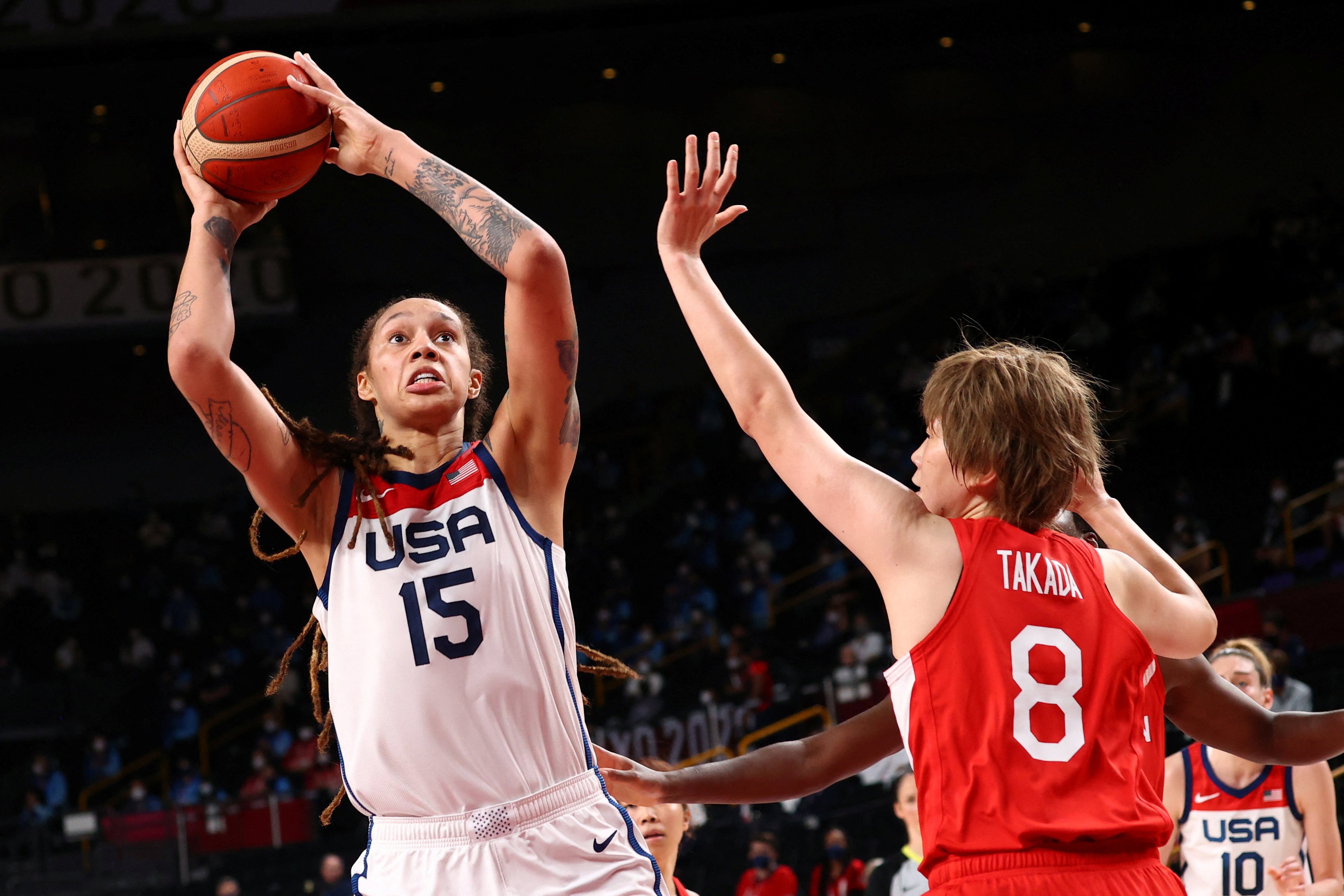 FILE PHOTO: Tokyo 2020 Olympics - Basketball - Women - Gold medal match - United States v Japan - Saitama Super Arena, Saitama, Japan - August 8, 2021. Brittney Griner of the United States in action with Maki Takada of Japan REUTERS/Brian Snyder/File Photo