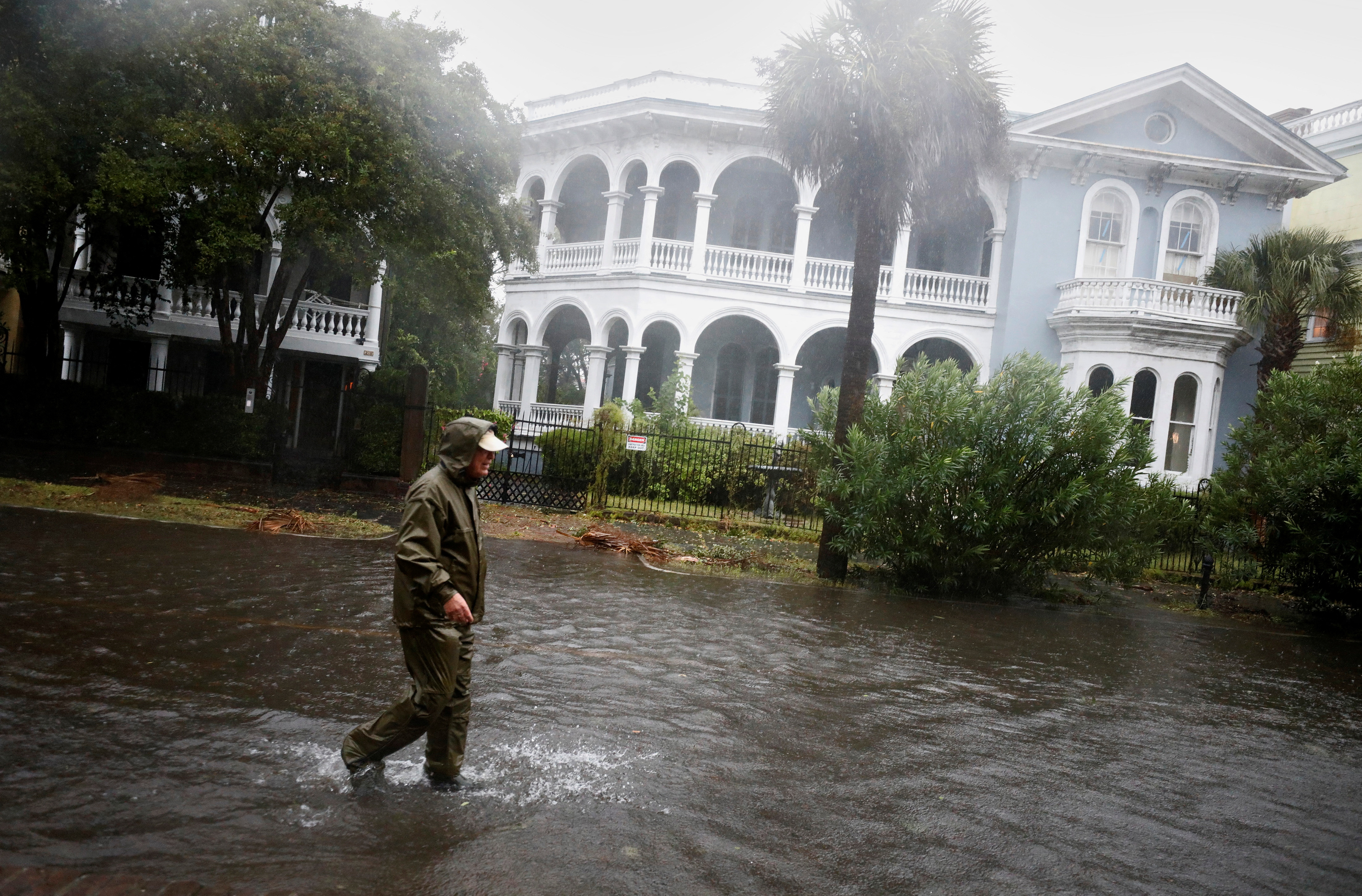 A resident walks in a flooded street in Charleston, South Carolina