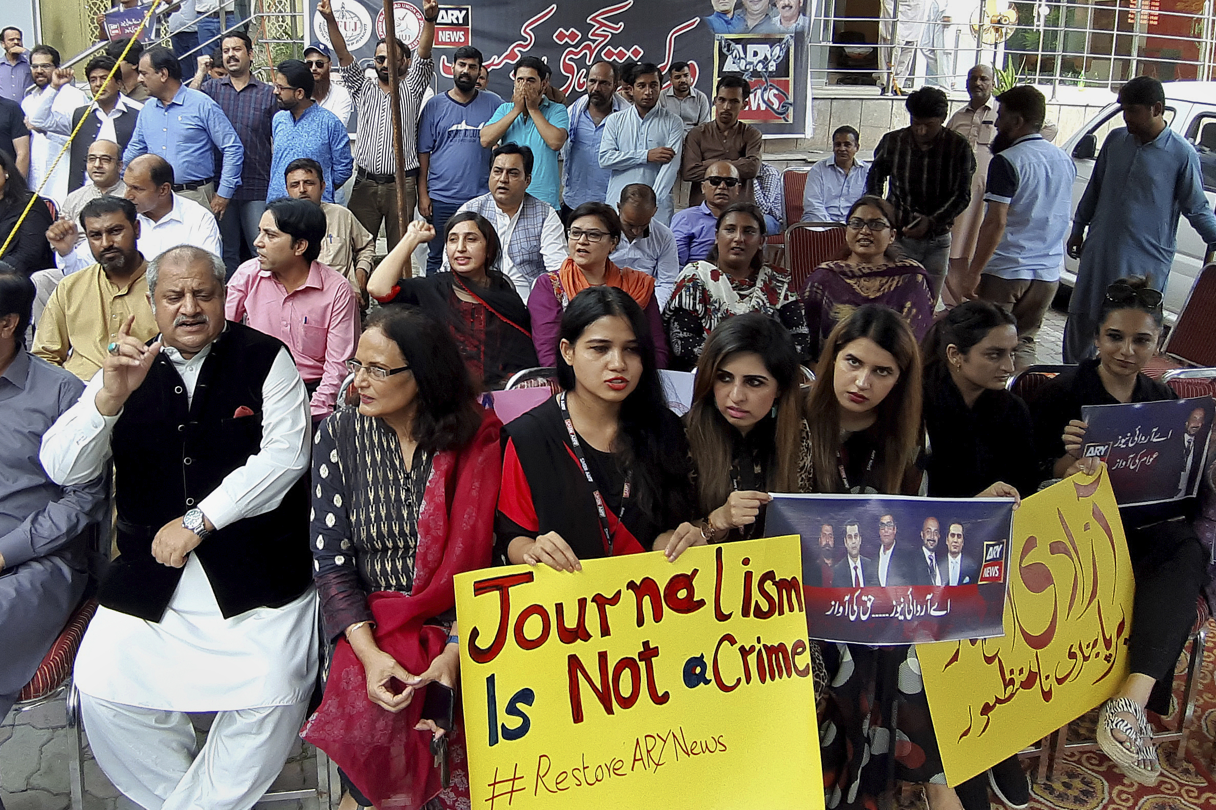 Journalists and employees of a private news channel ARY hold a protest against their channel being taken off-air by the Pakistan media regulator authority