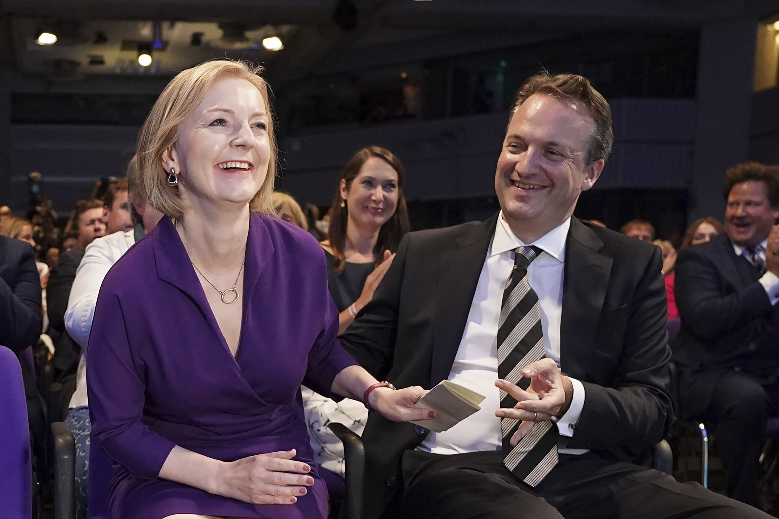 Liz Truss and her husband Hugh O'Leary react at the Queen Elizabeth II Centre in London