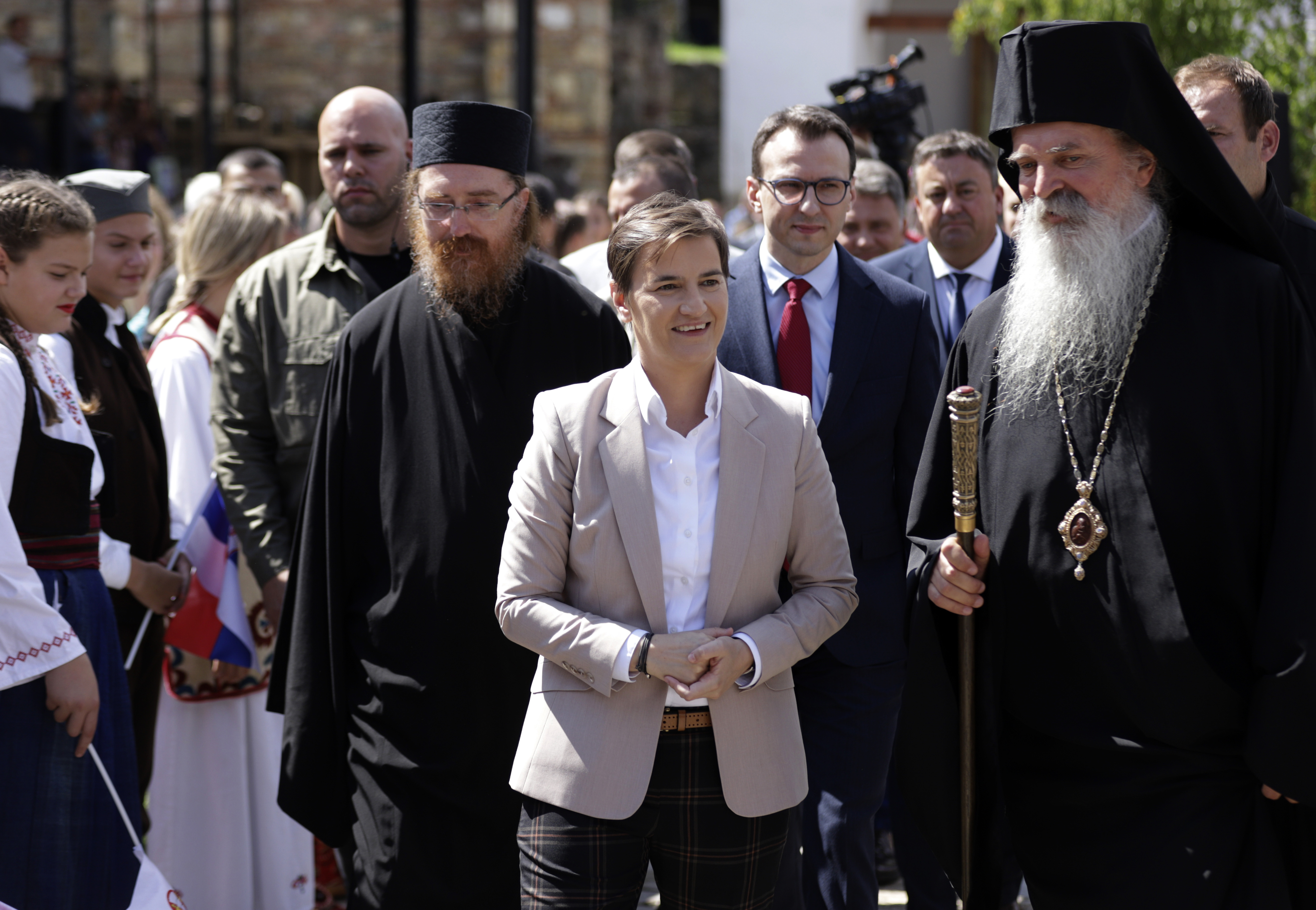 Serbian Prime Minister Ana Brnabic, centre, arrives in the Banjska Orthodox monastery with Serb Orthodox bishop Teodosije in the village Banjska, 15km north of Mitrovica, Kosovo