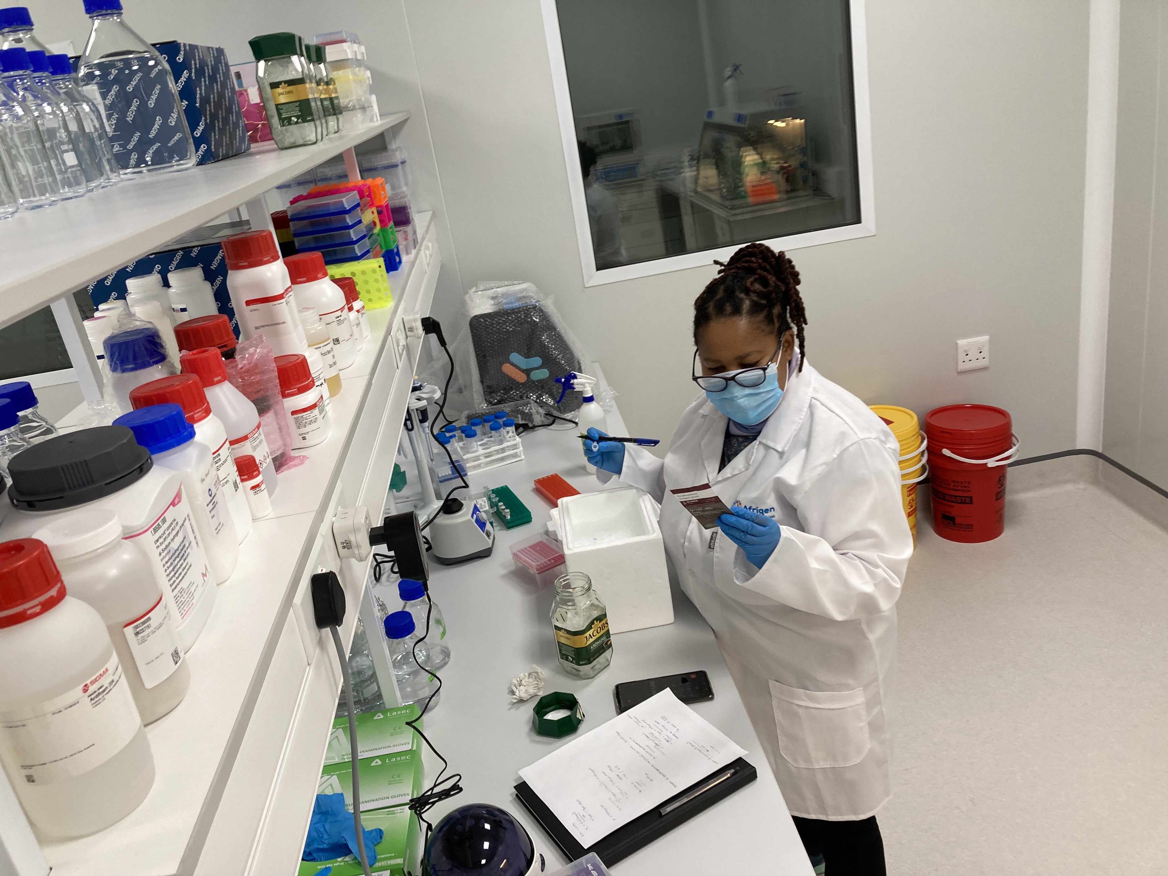 A scientist logs data in an analytical laboratory