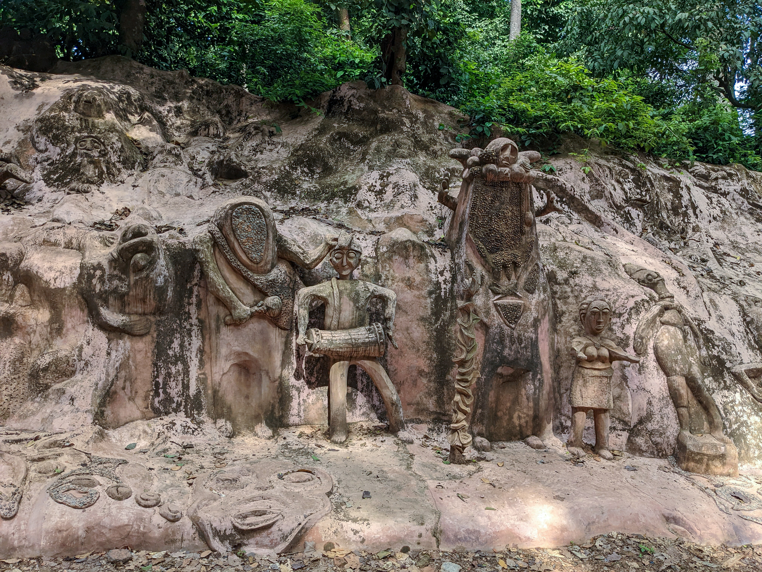 Carvings of orisas and other Yoruba spiritual symbols at the Osun Osogbo sacred grove. [Eromo Egbejule/Al Jazeera]