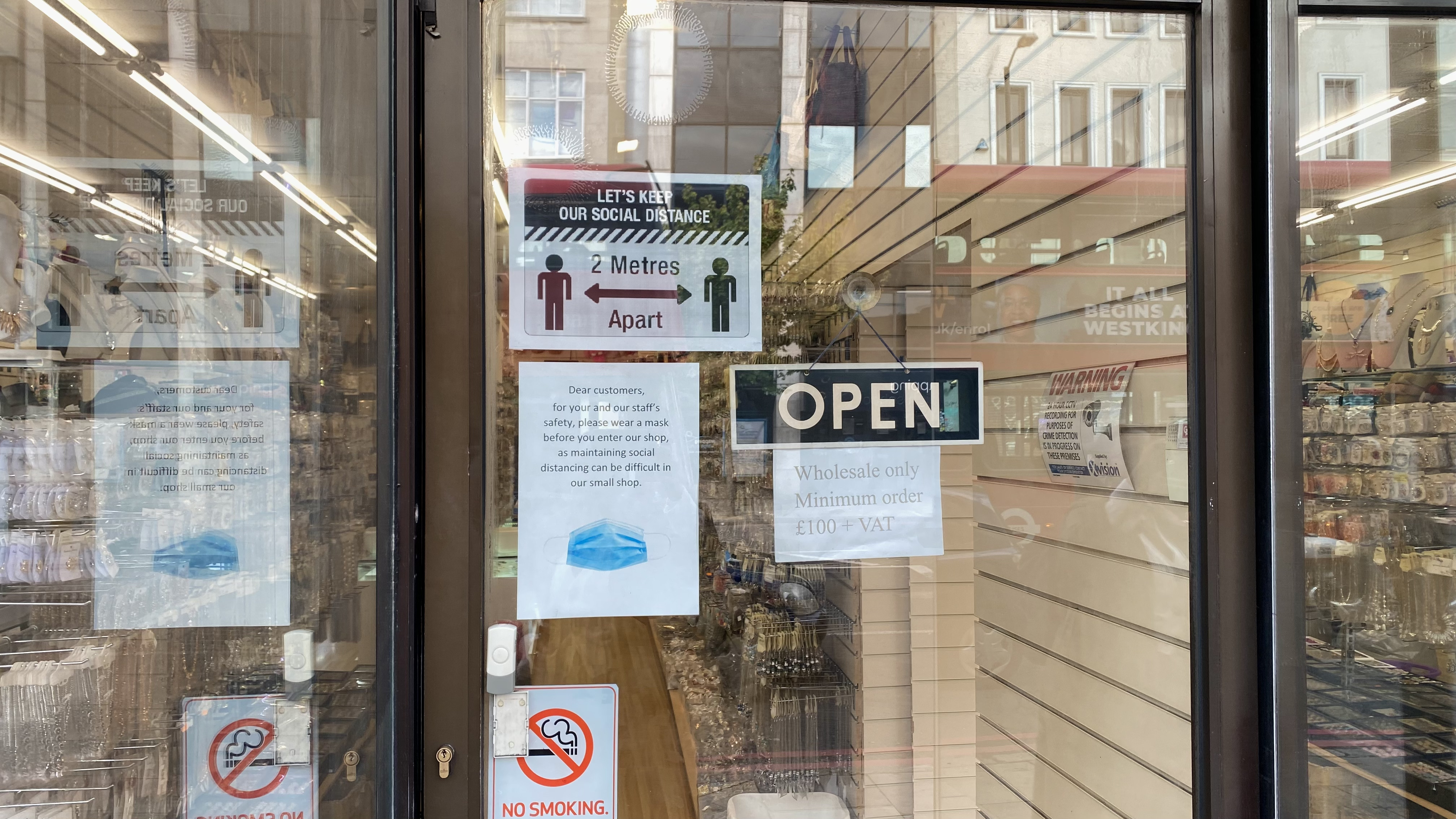 Shop window with Covid safety signs.