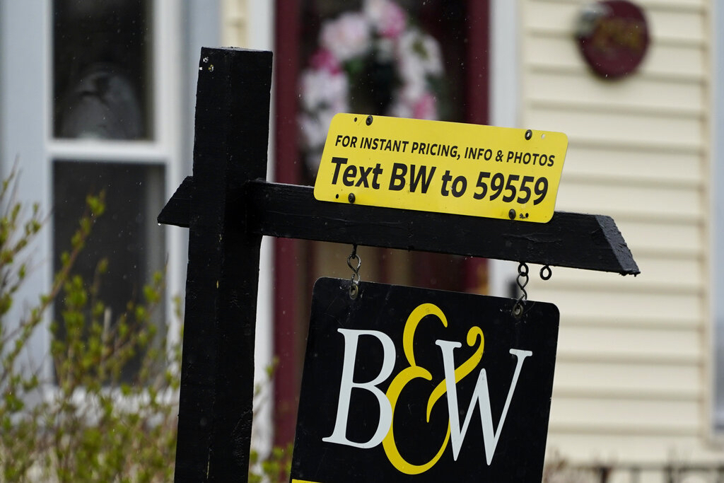 A sign is displayed outside a home in Wheeling, Ill.