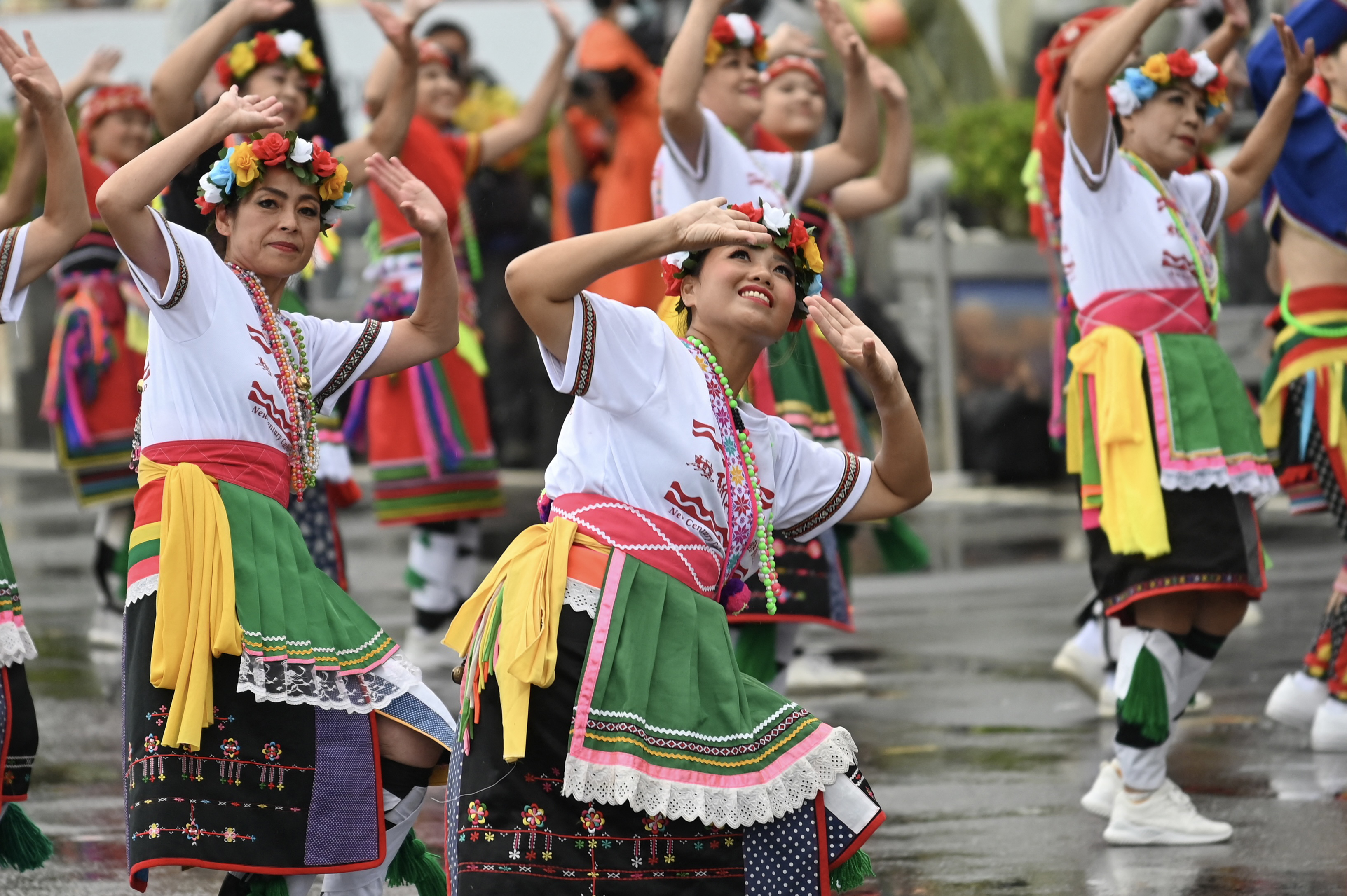 Dancers in colourful dress perform during Taiwan national day celebrations