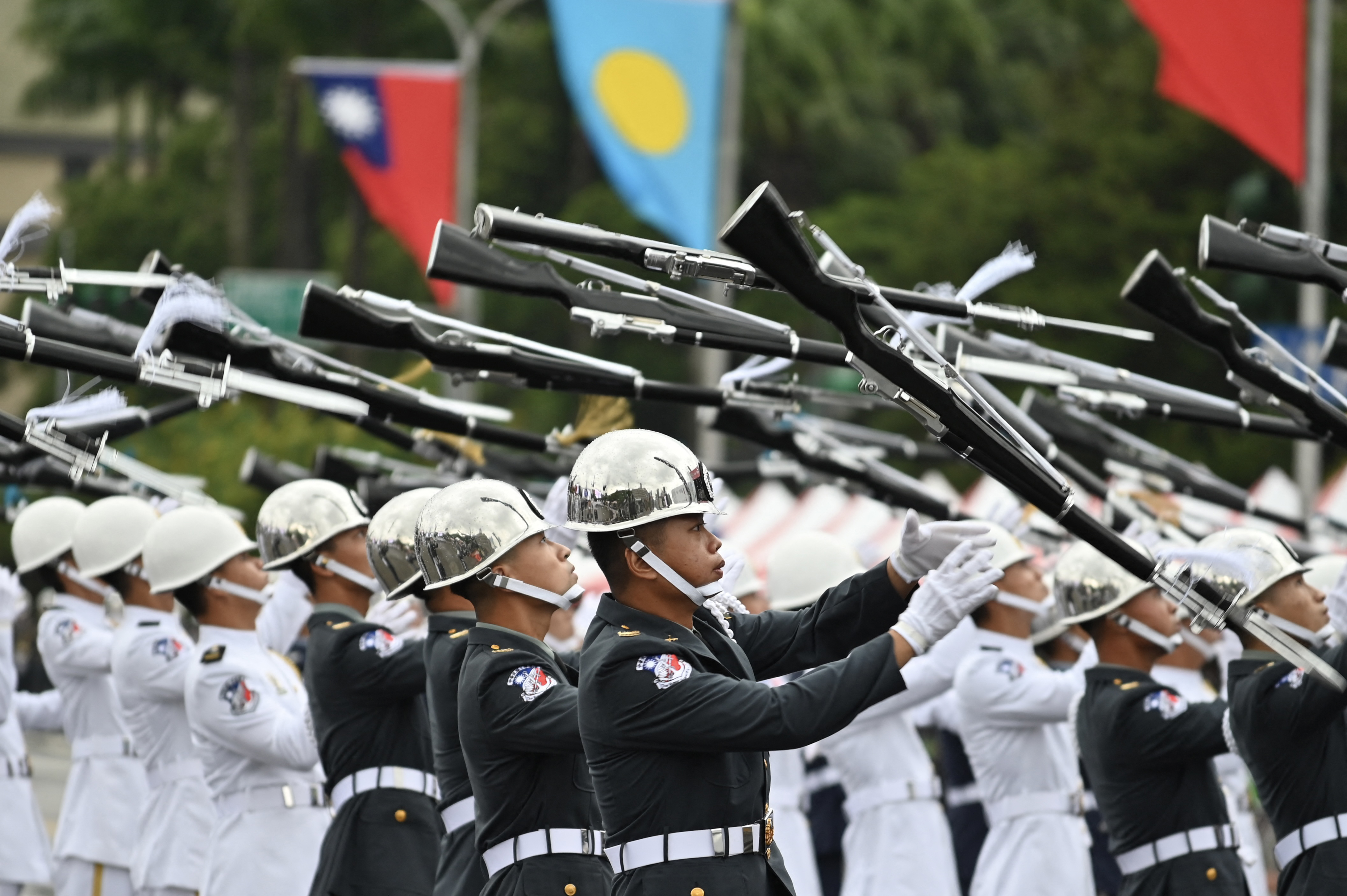 Honour guards parade with rifles during Taiwan's national day celebrations