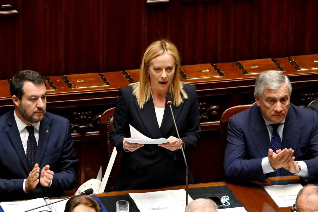 Italys new Prime Minister Giorgia Meloni (C) speaks in her first address to parliament