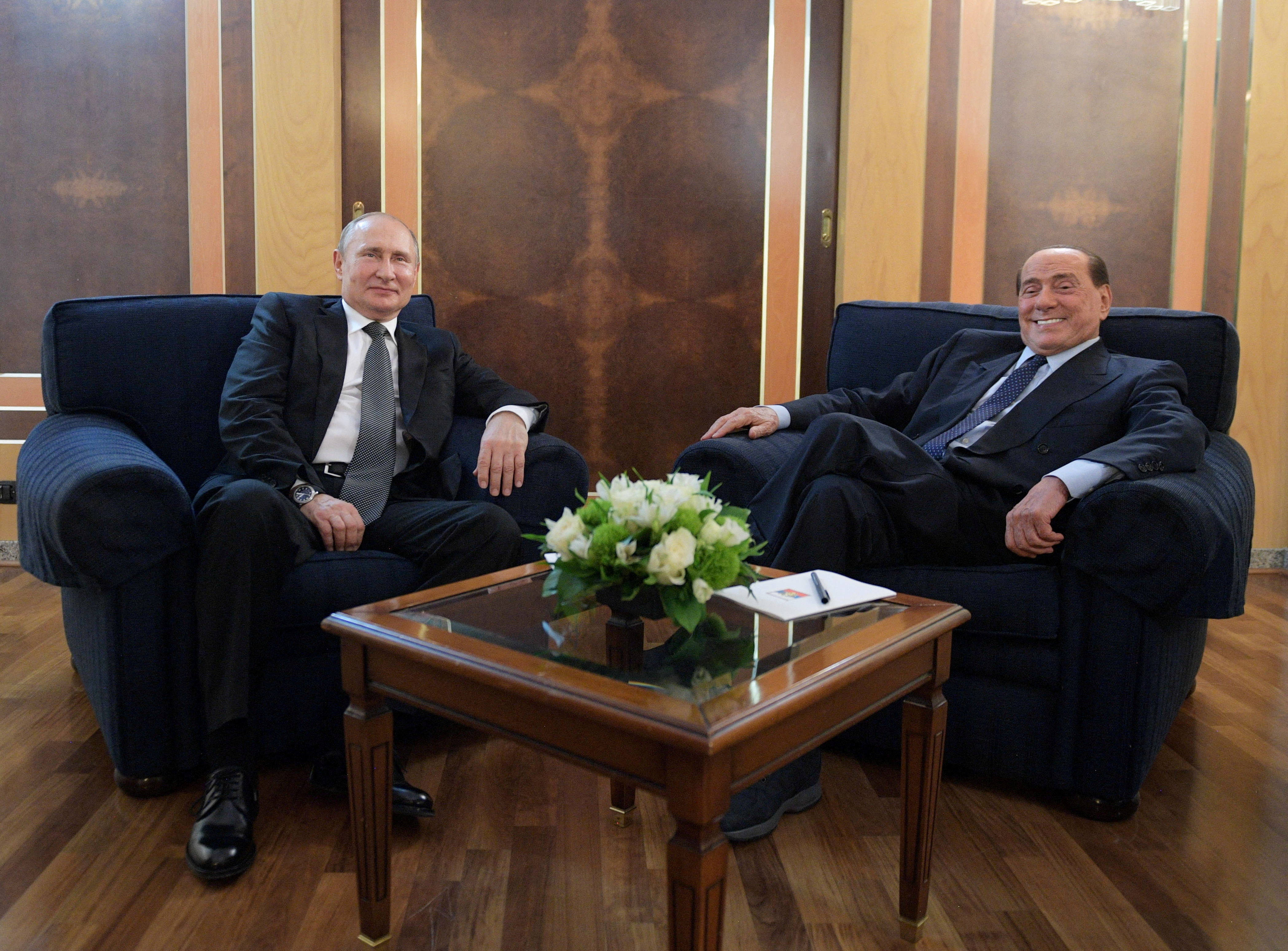 FILE PHOTO: Russian President Vladimir Putin meets with Italian Member of the European Parliament Silvio Berlusconi