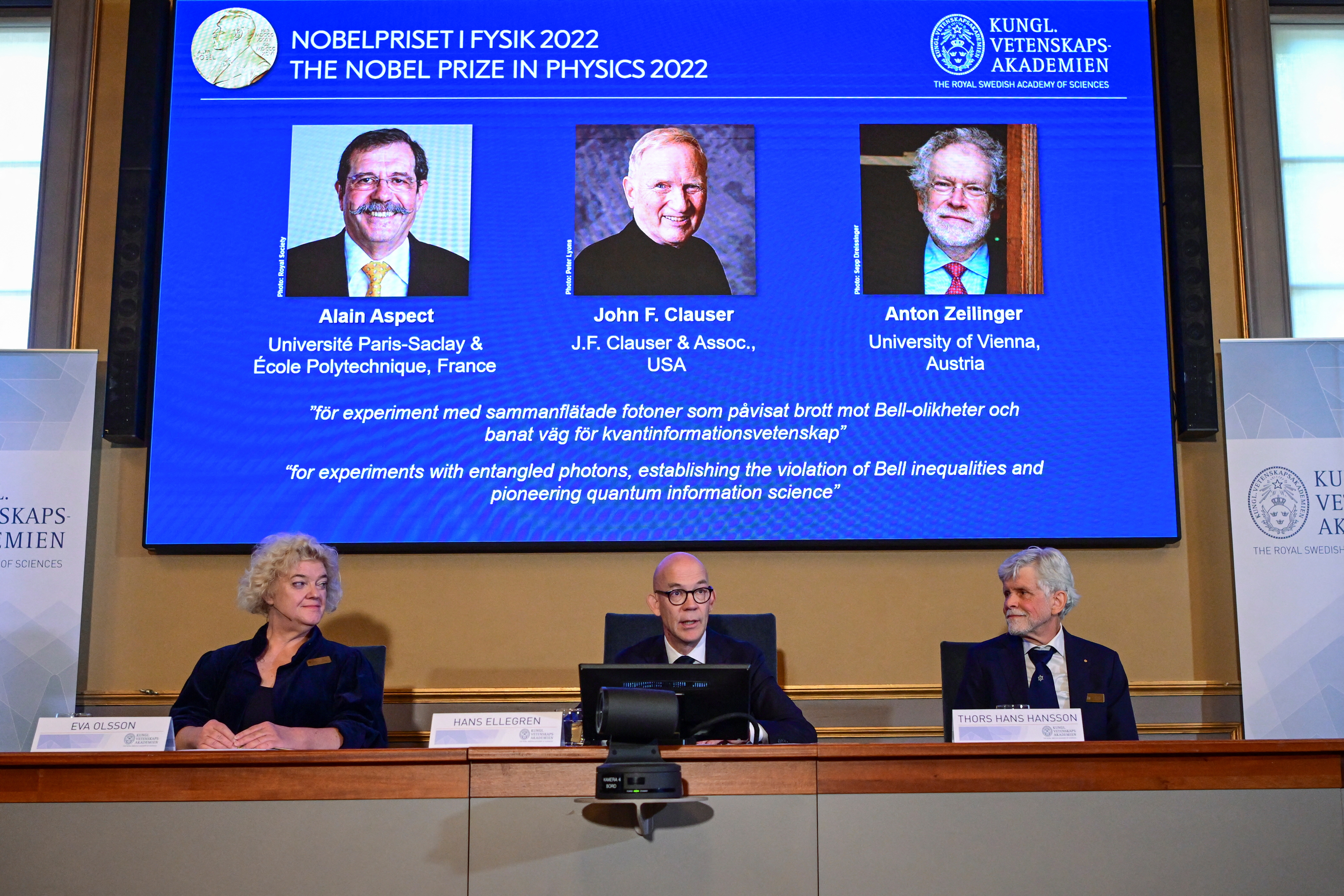 Secretary General of the Royal Swedish Academy of Sciences Hans Ellegren, Eva Olsson and Thors Hans Hansson, members of the Nobel Committee for Physics announce the winners of the 2022 Nobel Prize in Physics Alain Aspect, John F. Clauser and Anton Zeilinger, during a news conference at The Royal Swedish Academy of Sciences in Stockholm, Sweden
