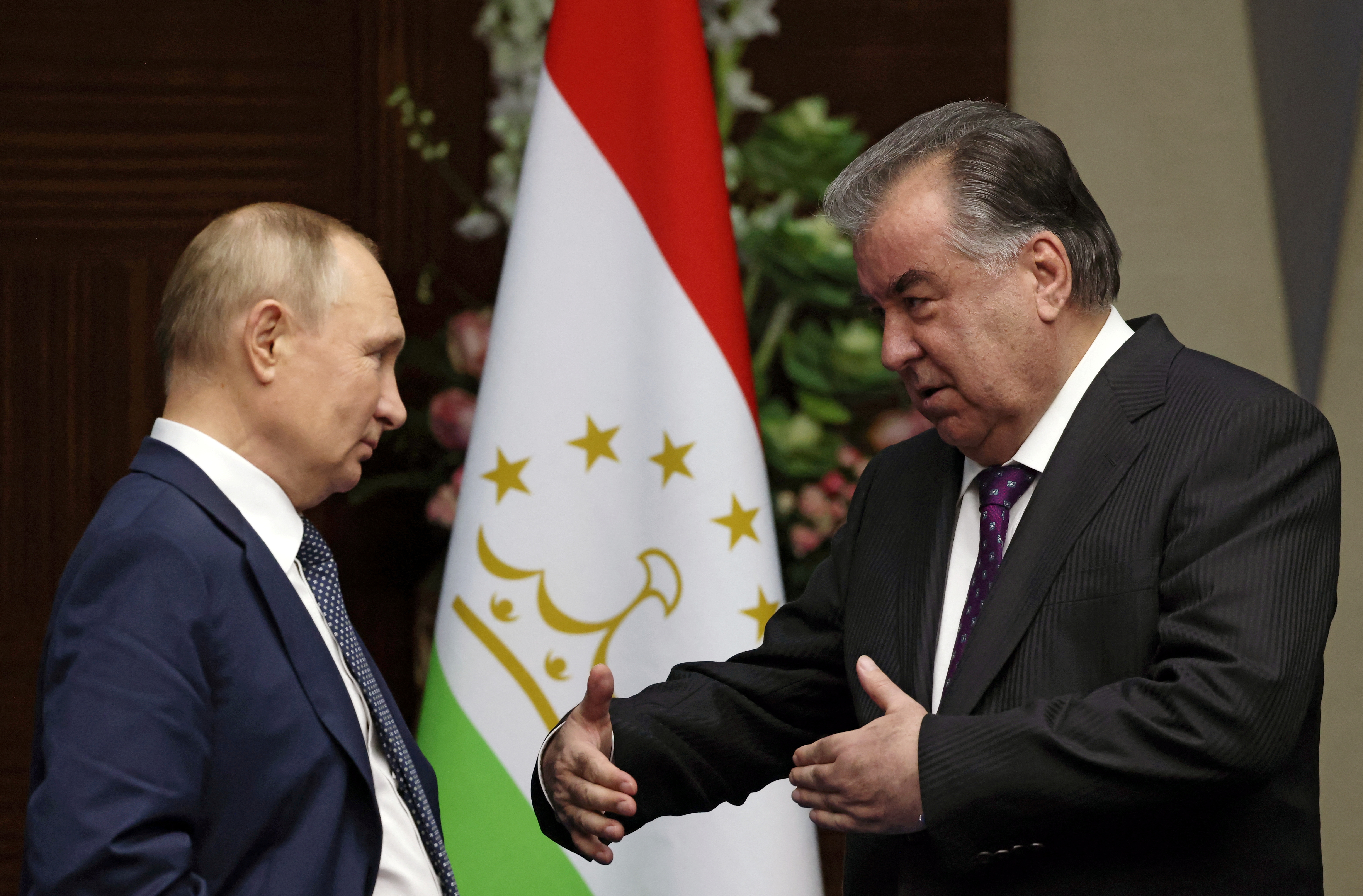 Russia's President Vladimir Putin, and Tajikistan's President Emomali Rakhmon talk ahead of trilateral meeting with Kyrgyzstan's President Sadyr Japarov on the sidelines of the 6th summit of the Conference on Interaction and Confidence-building Measures in Asia (CICA), in Astana, Kazakhstan October 13, 2022. Sputnik/Vyacheslav Prokofyev/Pool via REUTERS ATTENTION EDITORS - THIS IMAGE WAS PROVIDED BY A THIRD PARTY.