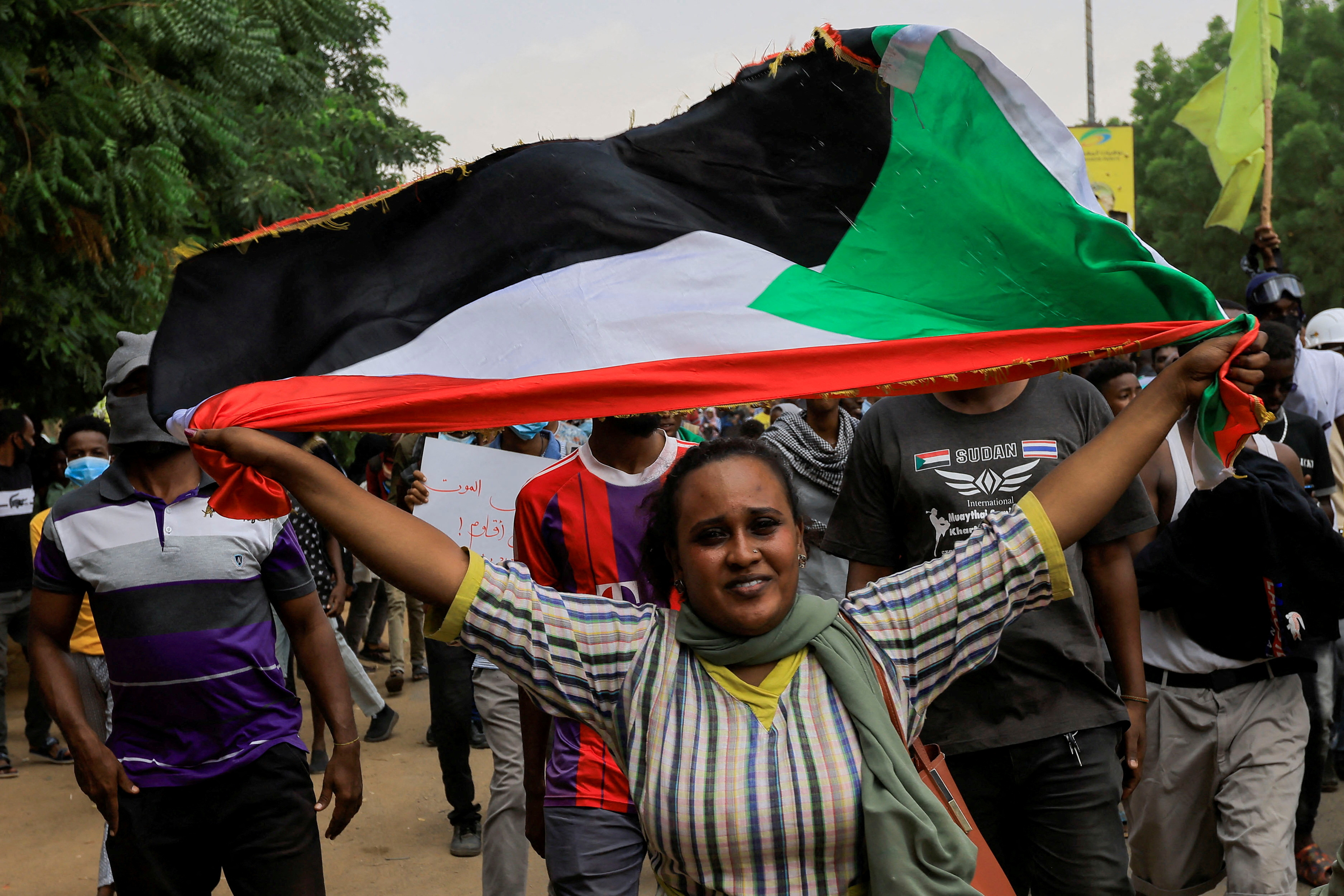 FILE PHOTO: Protesters march during a rally against military rule following the last coup, in Khartoum, Sudan July 31, 2022. REUTERS/Mohamed Nureldin Abdallah/File Photo