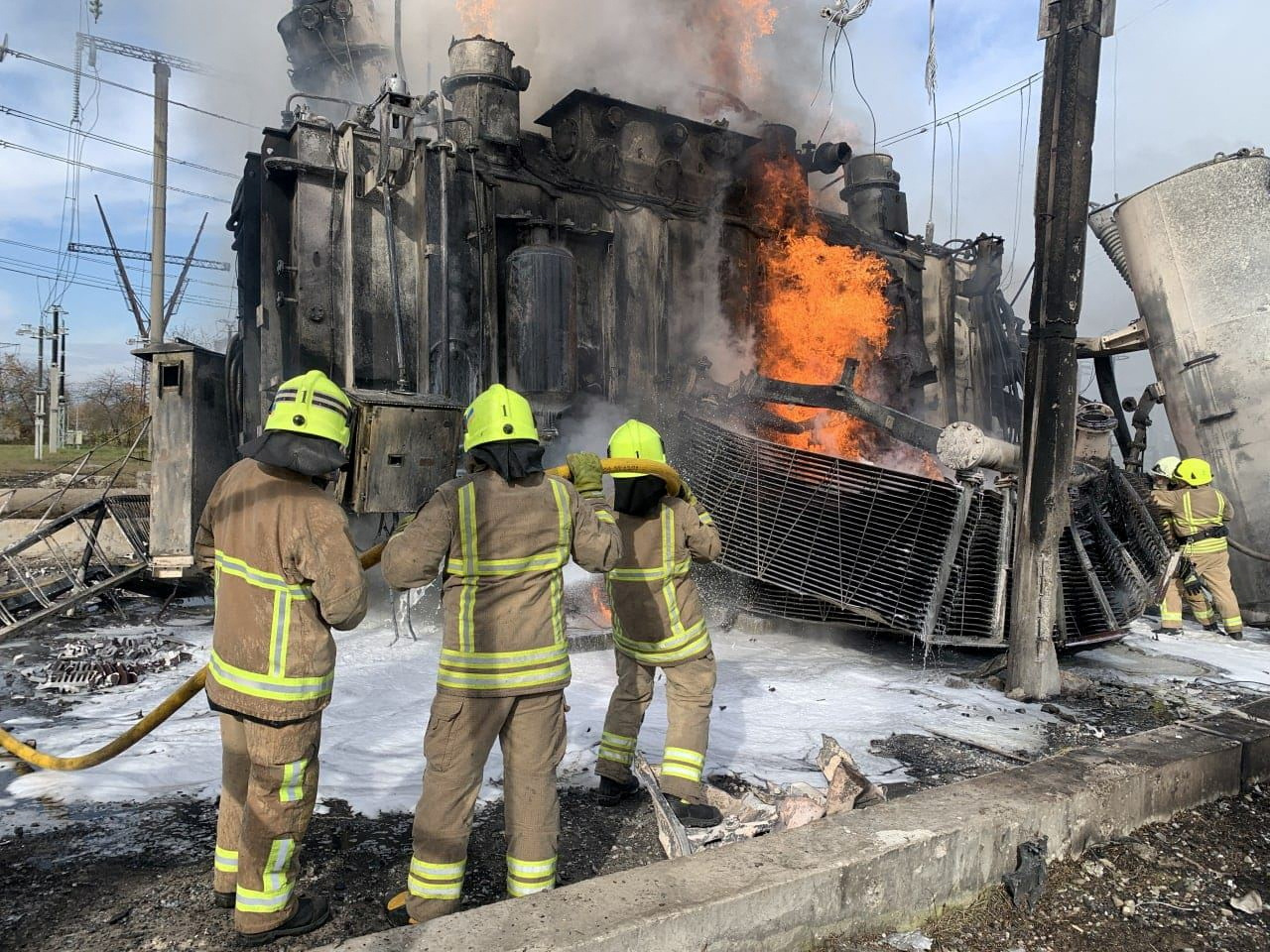 Firefighters work to put out a fire at energy infrastructure facilities, damaged by a Russian missile strike, as Russia's attack on Ukraine continues, in Rivne region, Ukraine October 22, 2022