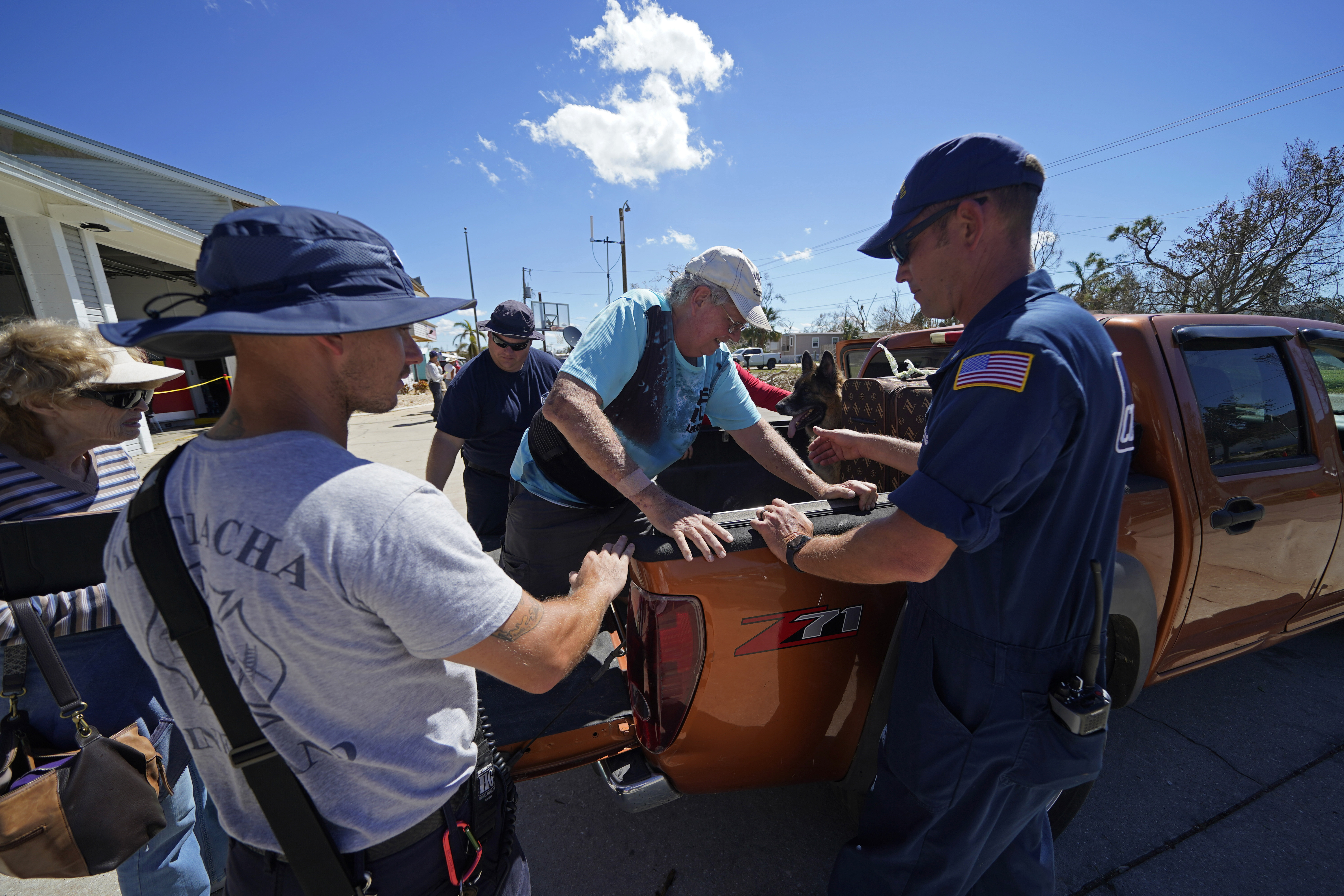 Responders help evacuate Andy Sherwood, a resident who rode out the storm, and had a hip replacement five weeks earlier, in the aftermath of Hurricane Ian on Pine Island