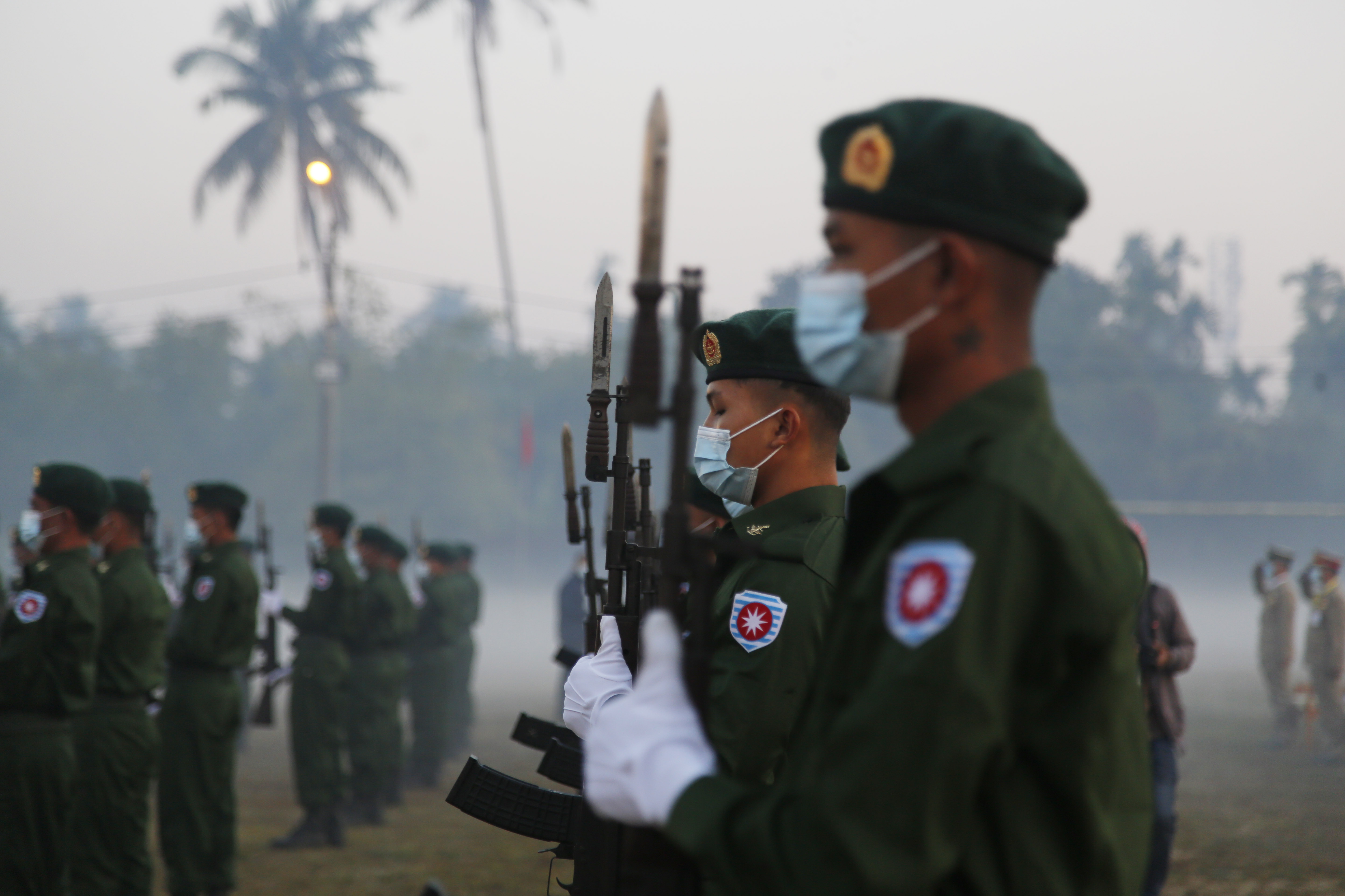 Myanmar honour guards stand during the parade to mark the 74th anniversary of Myanmar's Union Day in Sittwe a few days after the coup in February 2021.