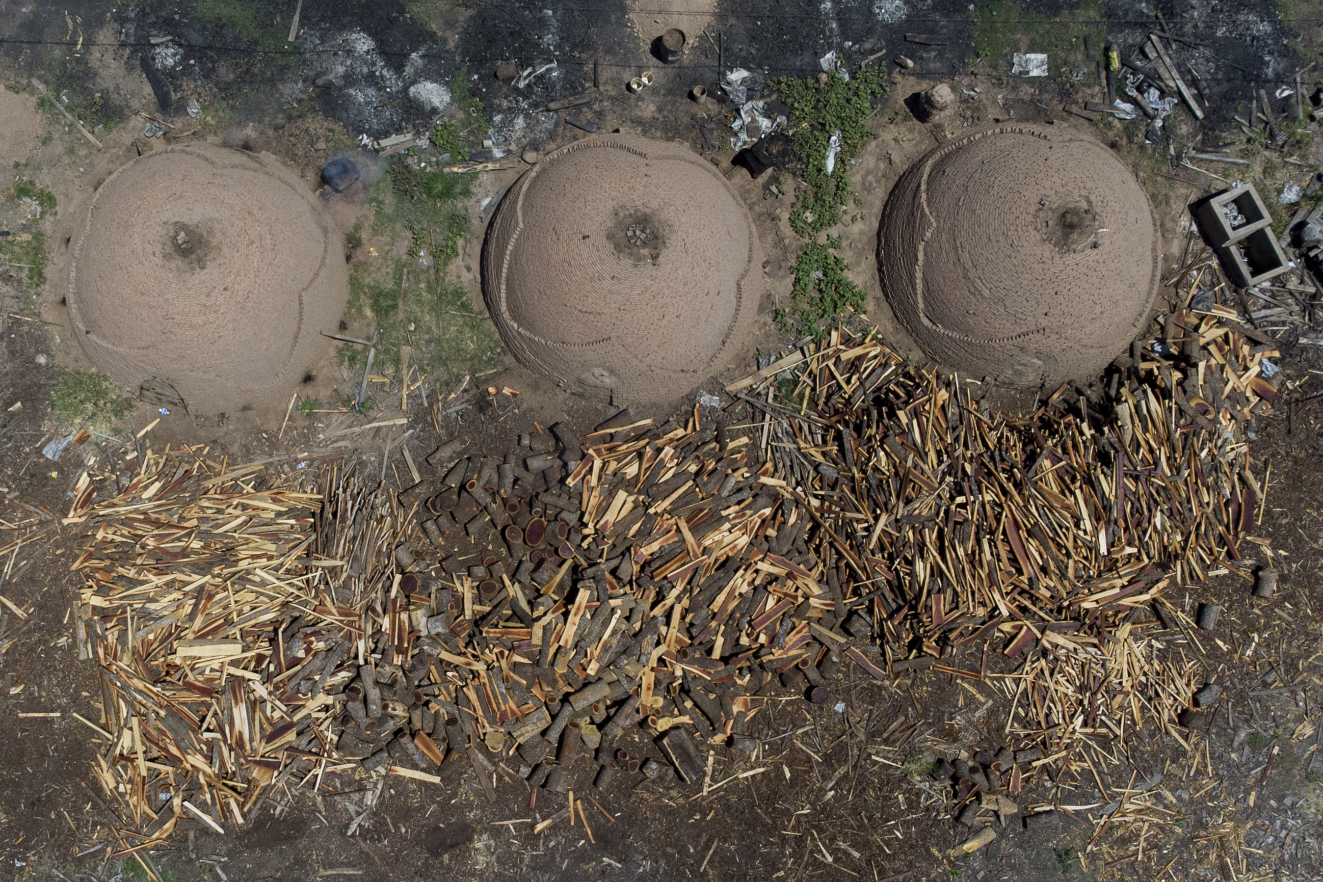 Aerial view of a factory for the production of charcoal with wood on the outskirts of Juan Jose Castelli, Chaco province, Argentina.