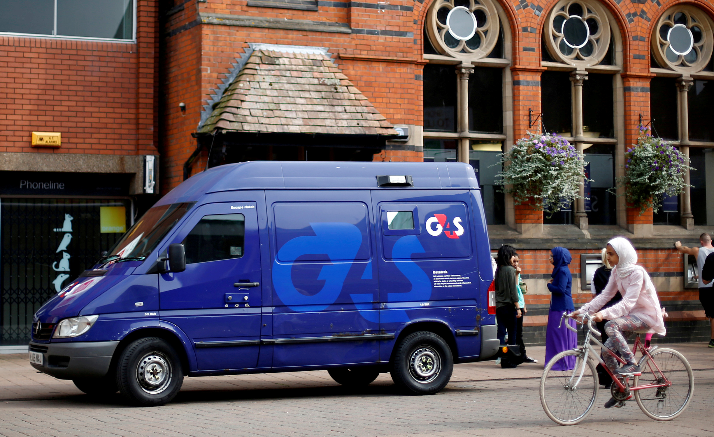 A G4S security van is seen parked outside a bank in Loughborough