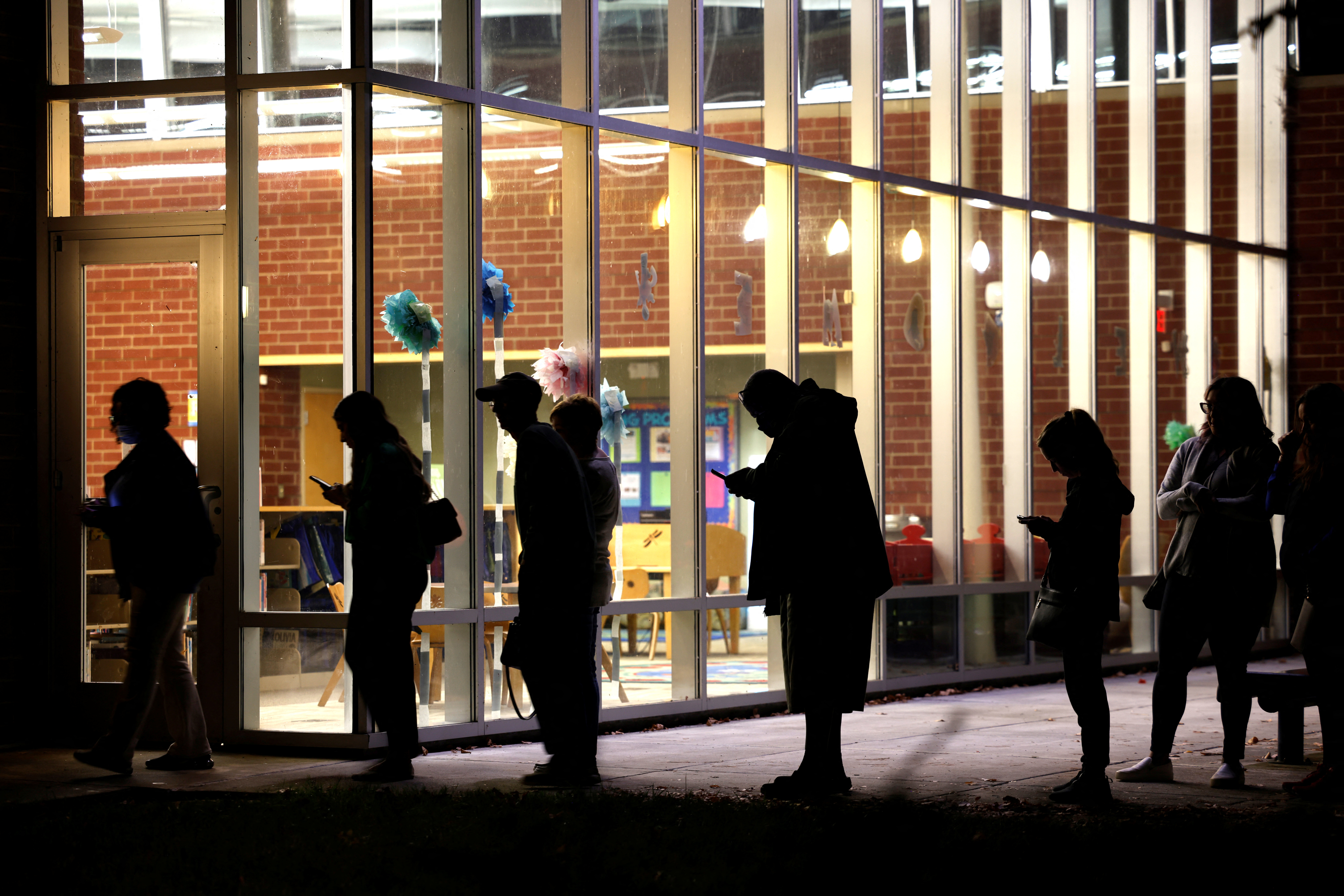Voters line up a few minutes before the polls close..