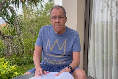 Russian Foreign Minister Sergey Lavrov reads documents on a patio in Bali, Indonesia, November 14, 2022, in this still image taken from video uploaded on the Telegram channel of foreign ministry spokeswoman Maria Zakharova [Maria Zakharova via Telegram/Handout via Reuters]