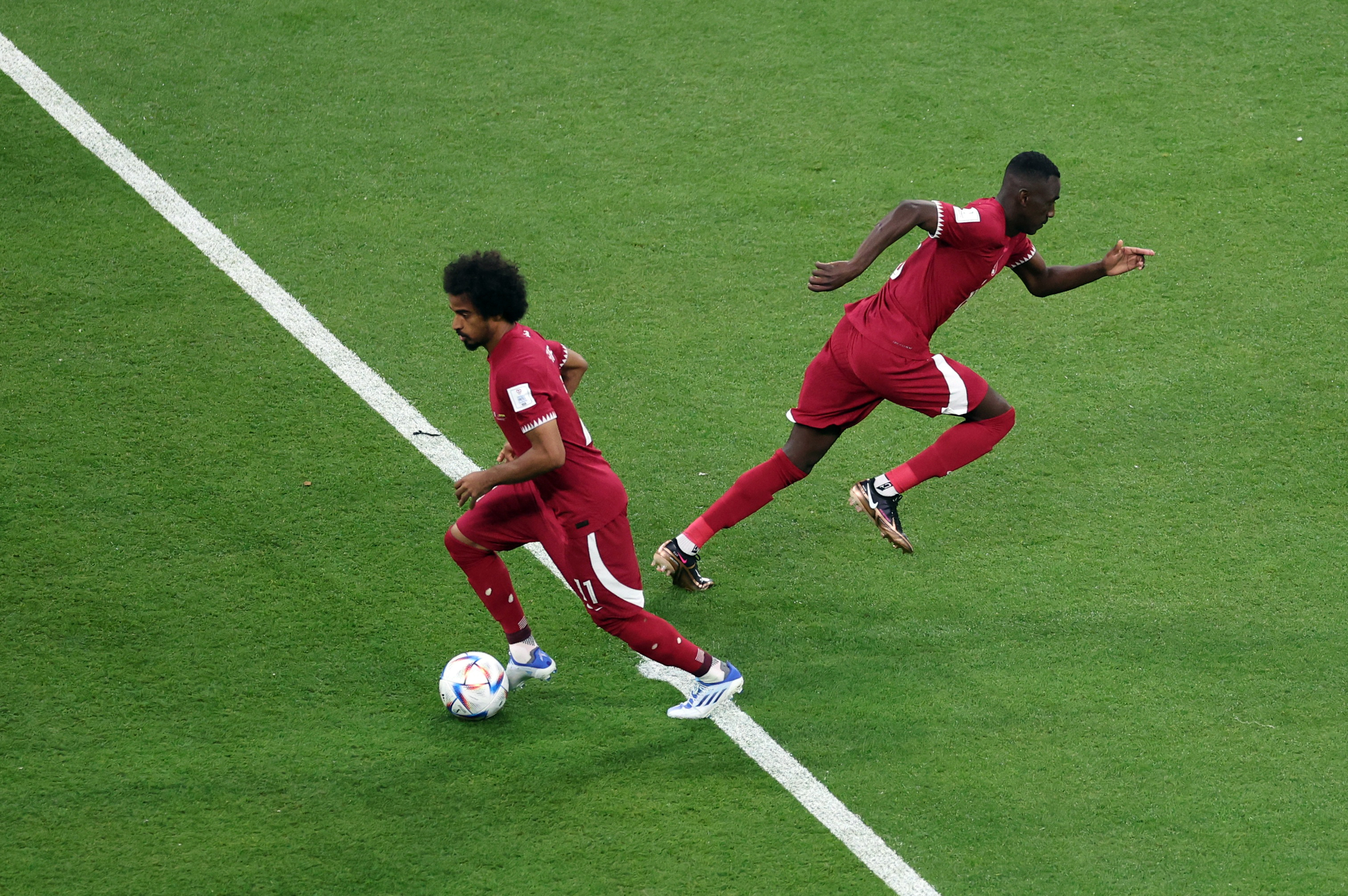 atar's Akram Afif in action during the kick off at the start of the match.