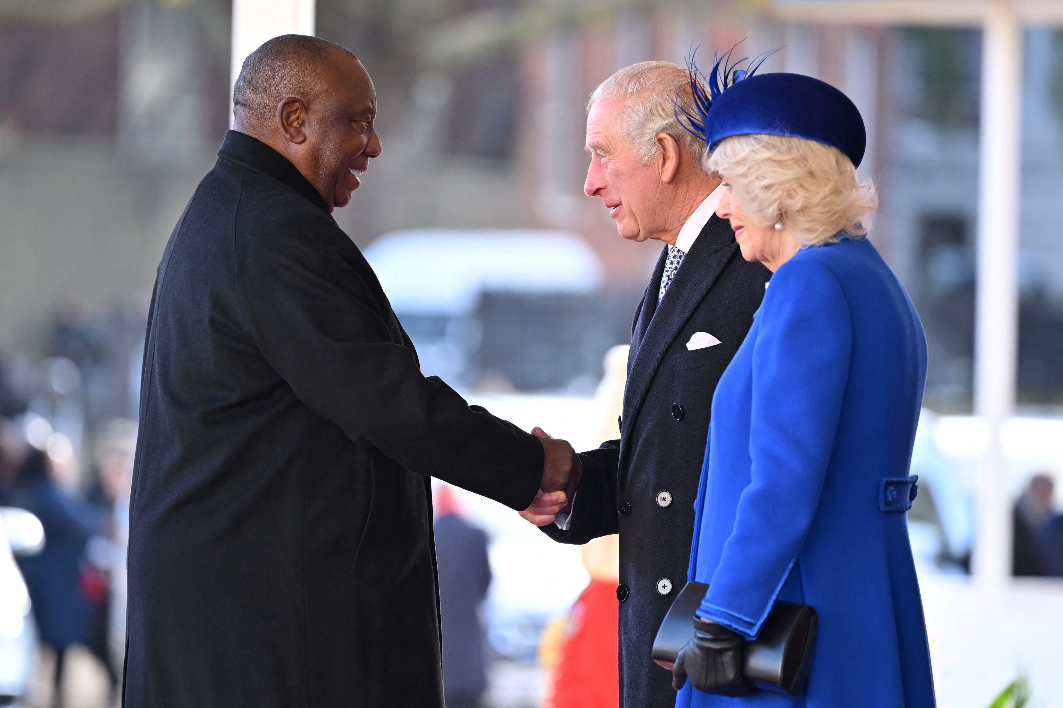 President of South Africa Cyril Ramaphosa shakes hands with King Charles III and Camilla, Queen Consort of the United Kingdom, during the welcome ceremony at Horse Guards Parade