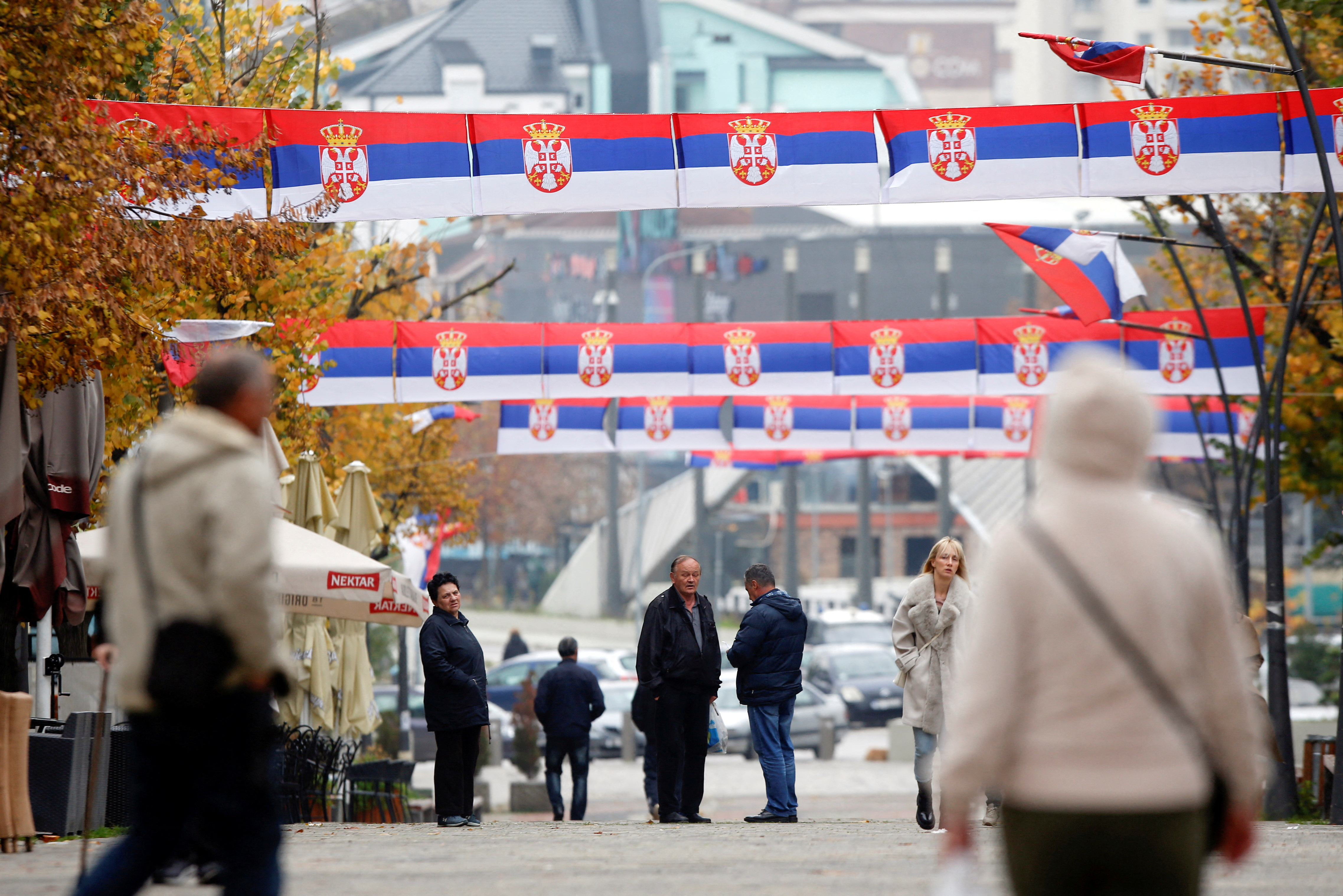 People walk at the square in North of Mitrovica