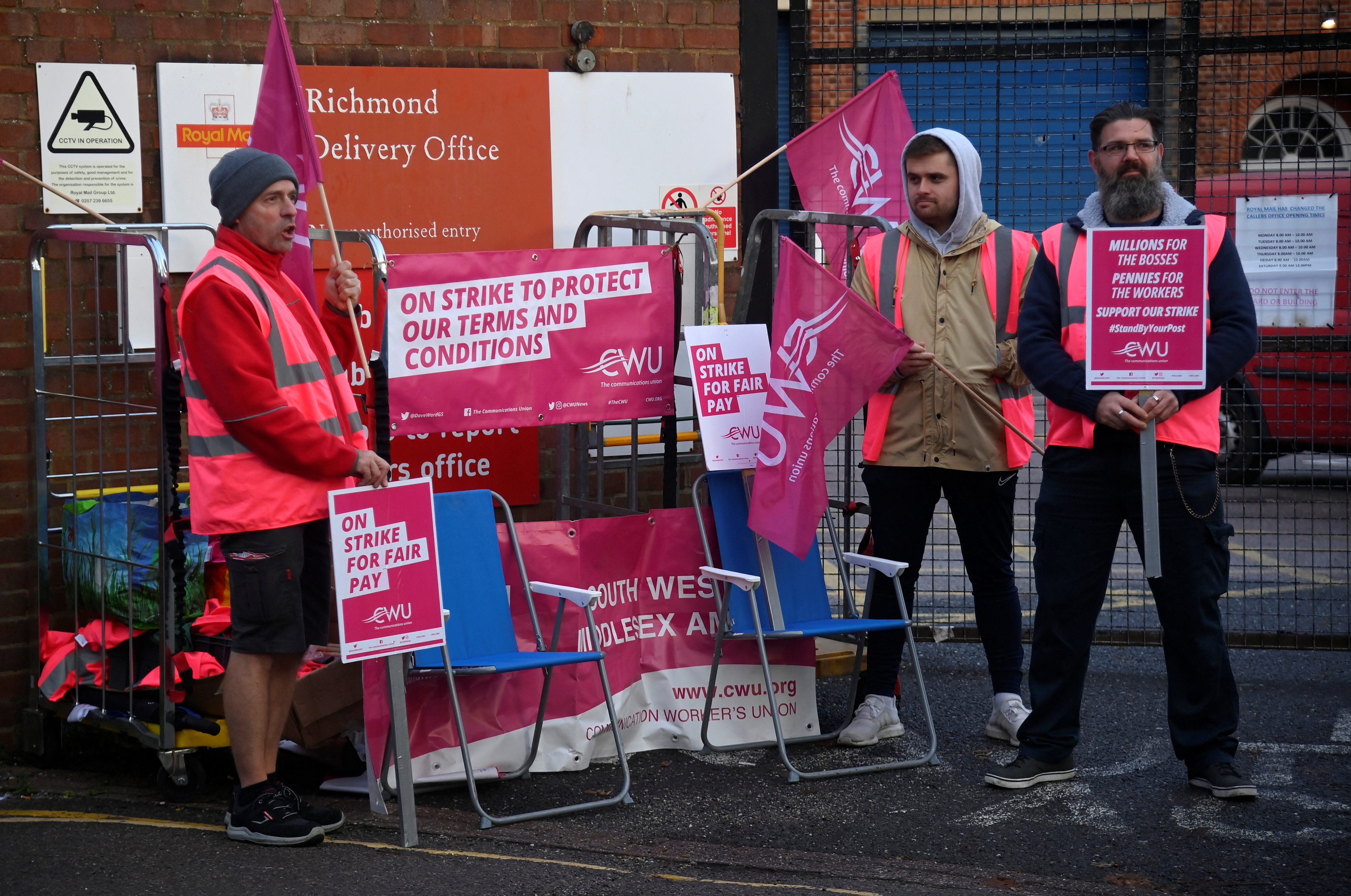 Royal Mail workers strike outside of the Richmond Delivery Office in London