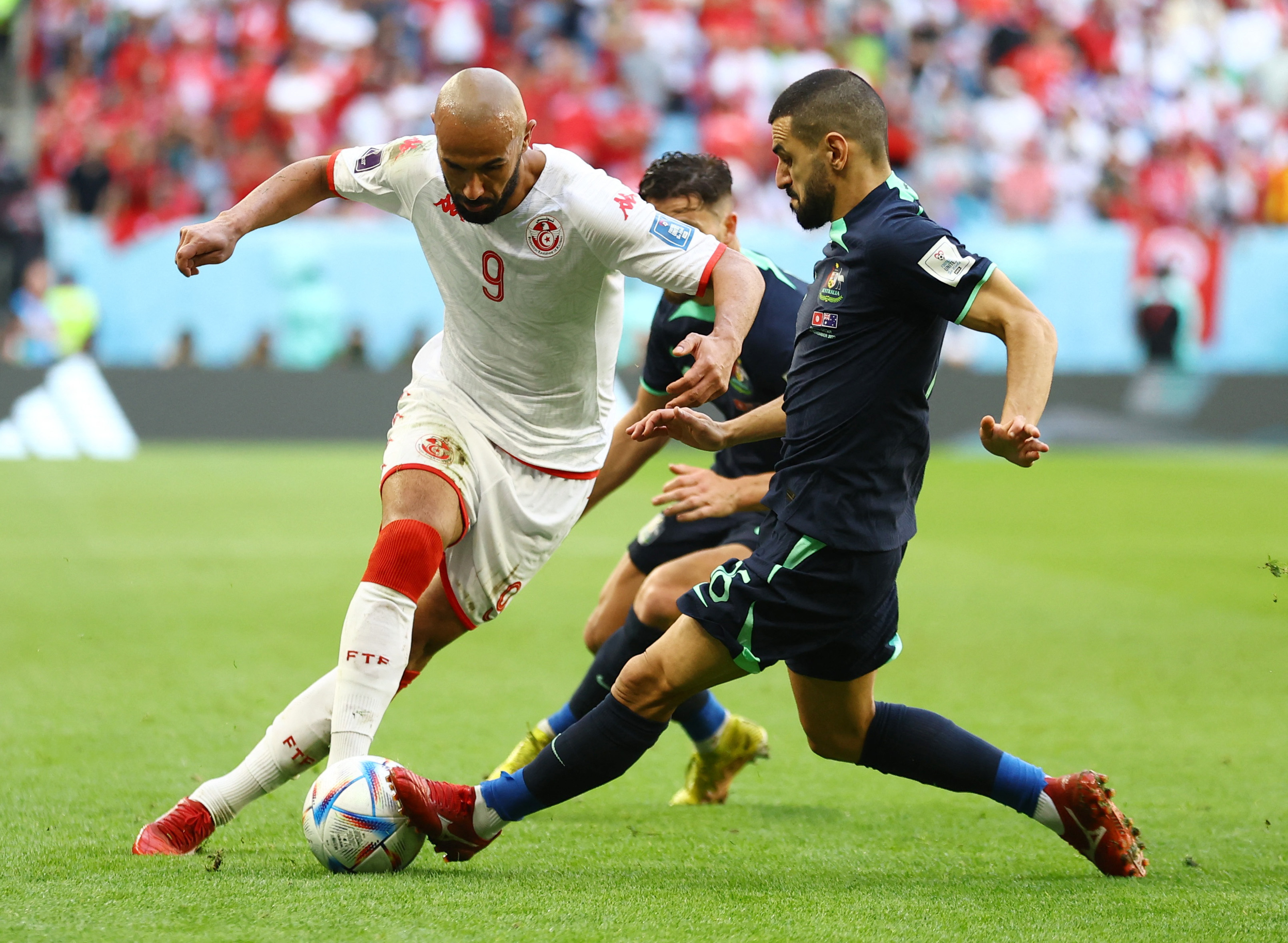 unisia's Issam Jebali in action with Australia's Aziz