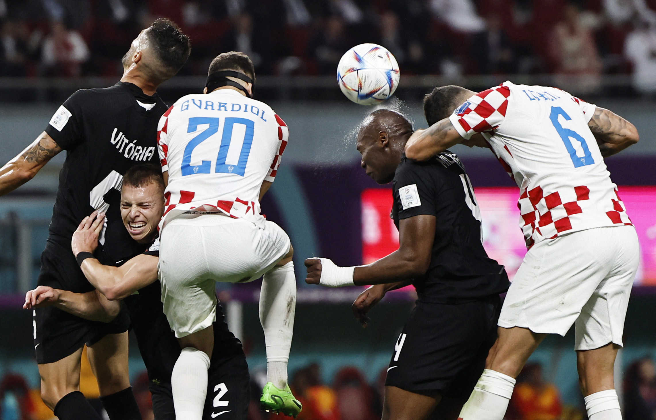 Croatia's Dejan Lovren in action with Canada's Kamal Miller