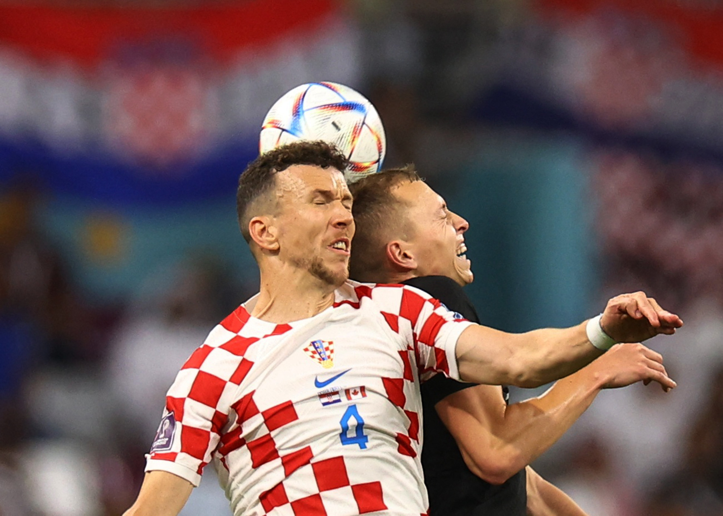 Croatia's Ivan Perisic in action with Canada's Alistair Johnston
