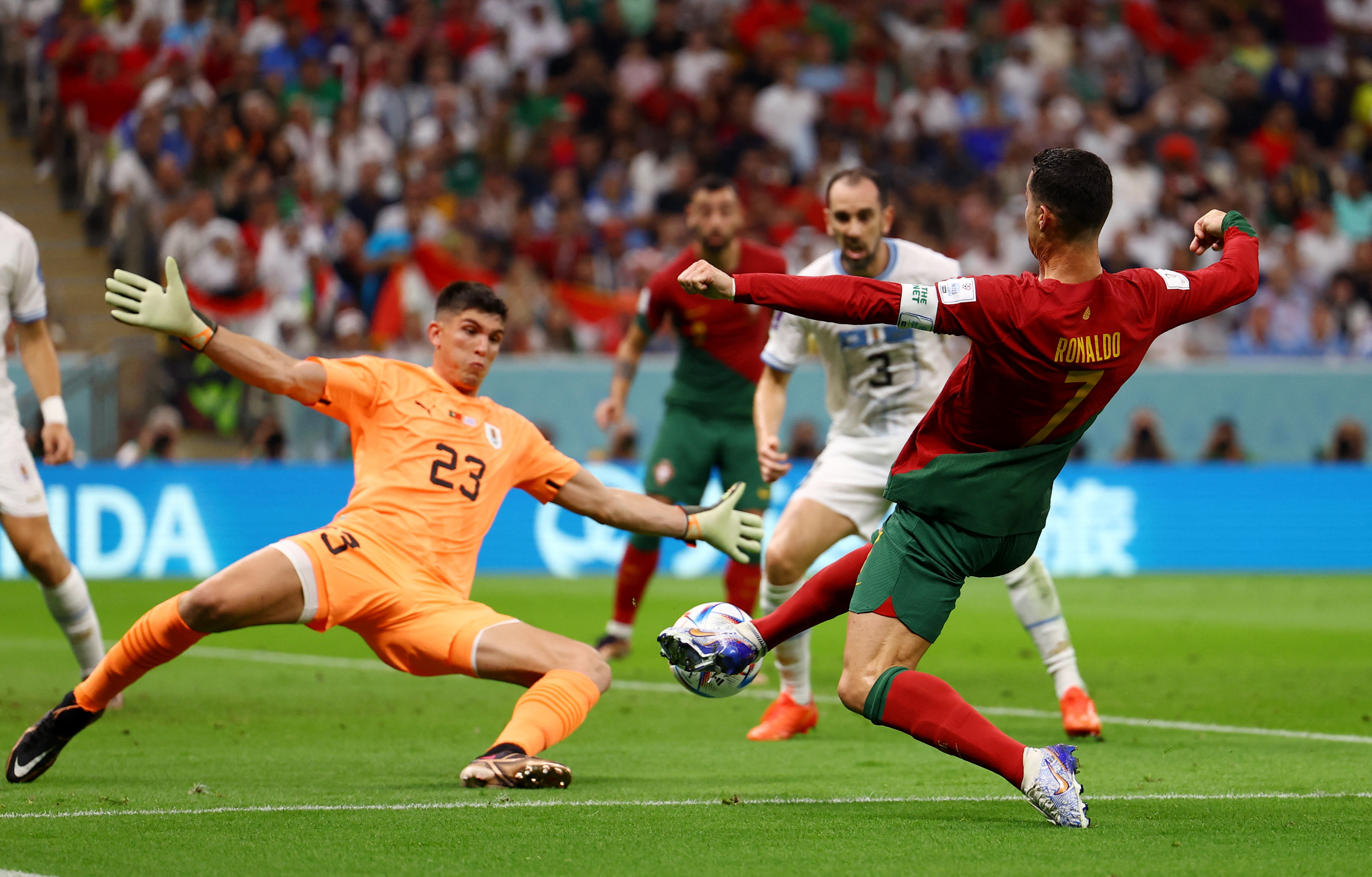 Uruguay's keeper, Sergio Rochet, saves from Portugal's Cristiano.