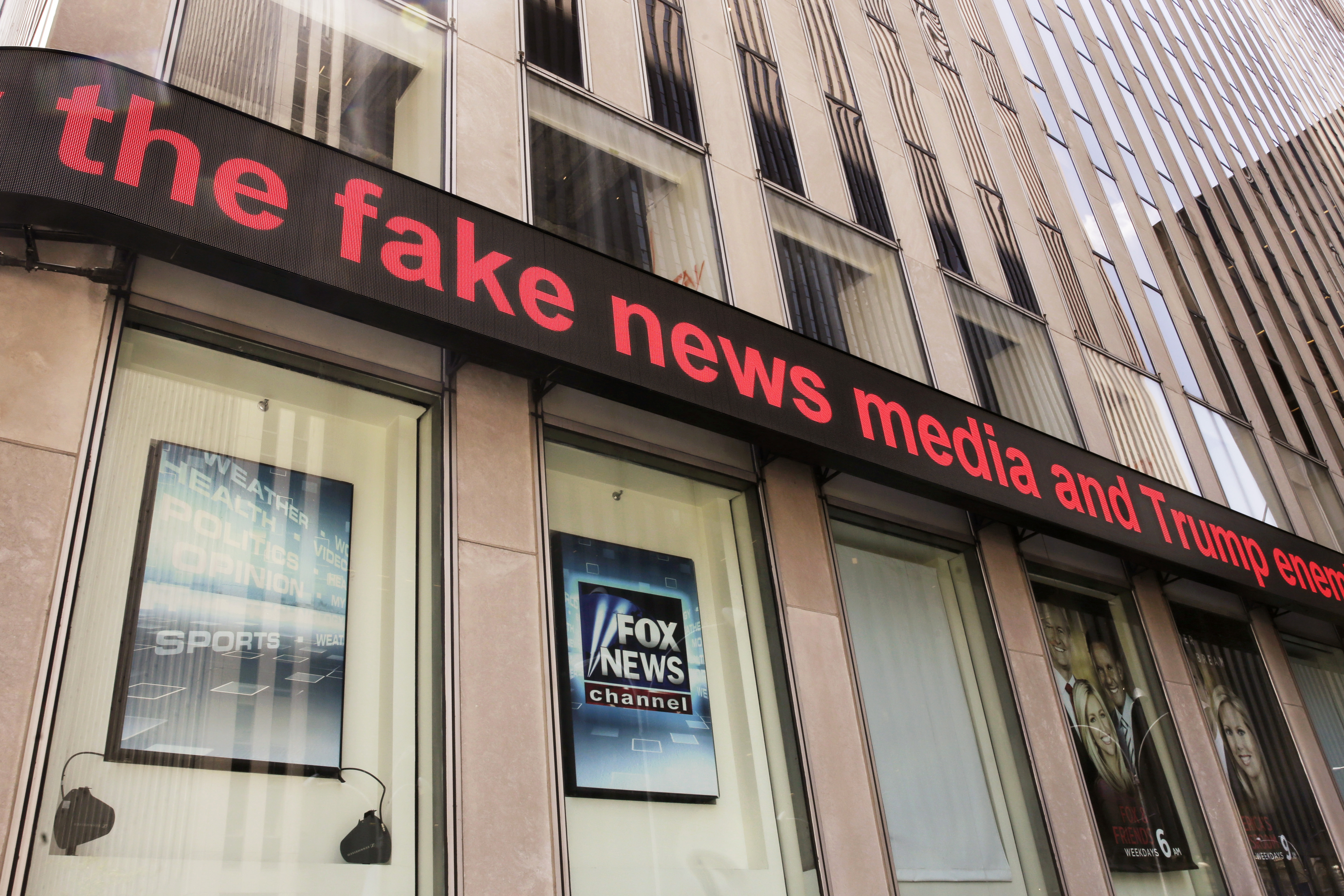 News headlines scroll above the Fox News studios in the News Corporation headquarters building in New York, Tuesday, Aug. 1, 2017. Fox contributor Rod Wheeler, who worked on the Seth Rich case, claims Fox News fabricated quotes implicating the murdered Democratic National Committee staffer in the Wikileaks scandal and that President Donald Trump pressured Fox to publish the story. He sued Fox for defamation on Tuesday. (AP Photo/Richard Drew)