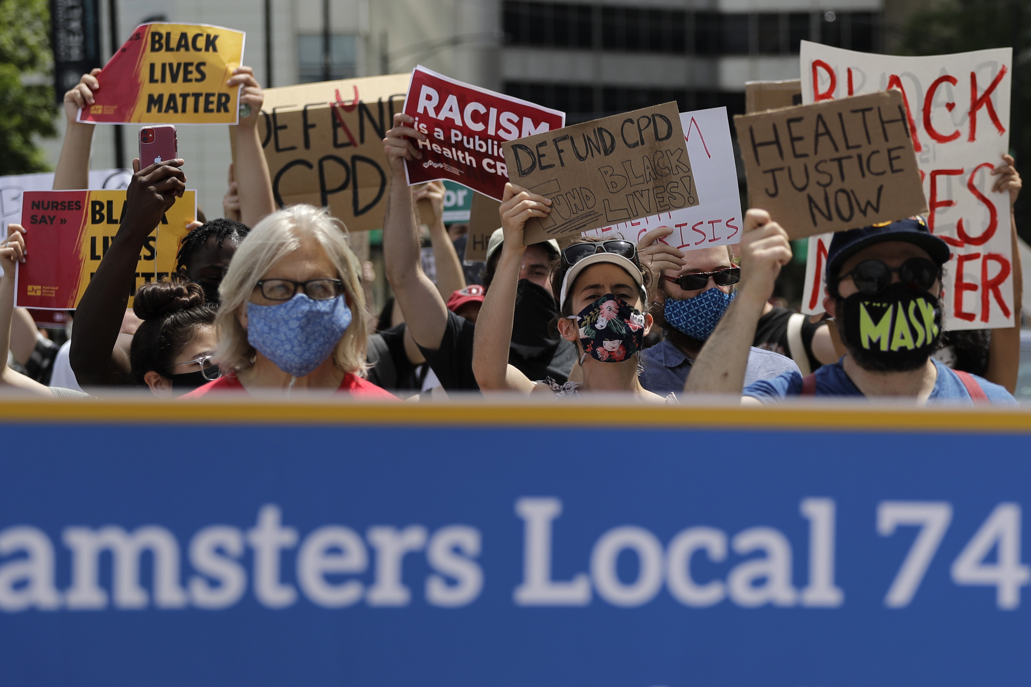 People march during the Health Care Justice demonstration rally in Chicago, Saturday, June 27, 2020. Chicago nurses, health care workers, and community activists united to protest racism in the healthcare industry and demand one, excellent standard of care for all people. (AP Photo/Nam Y. Huh)