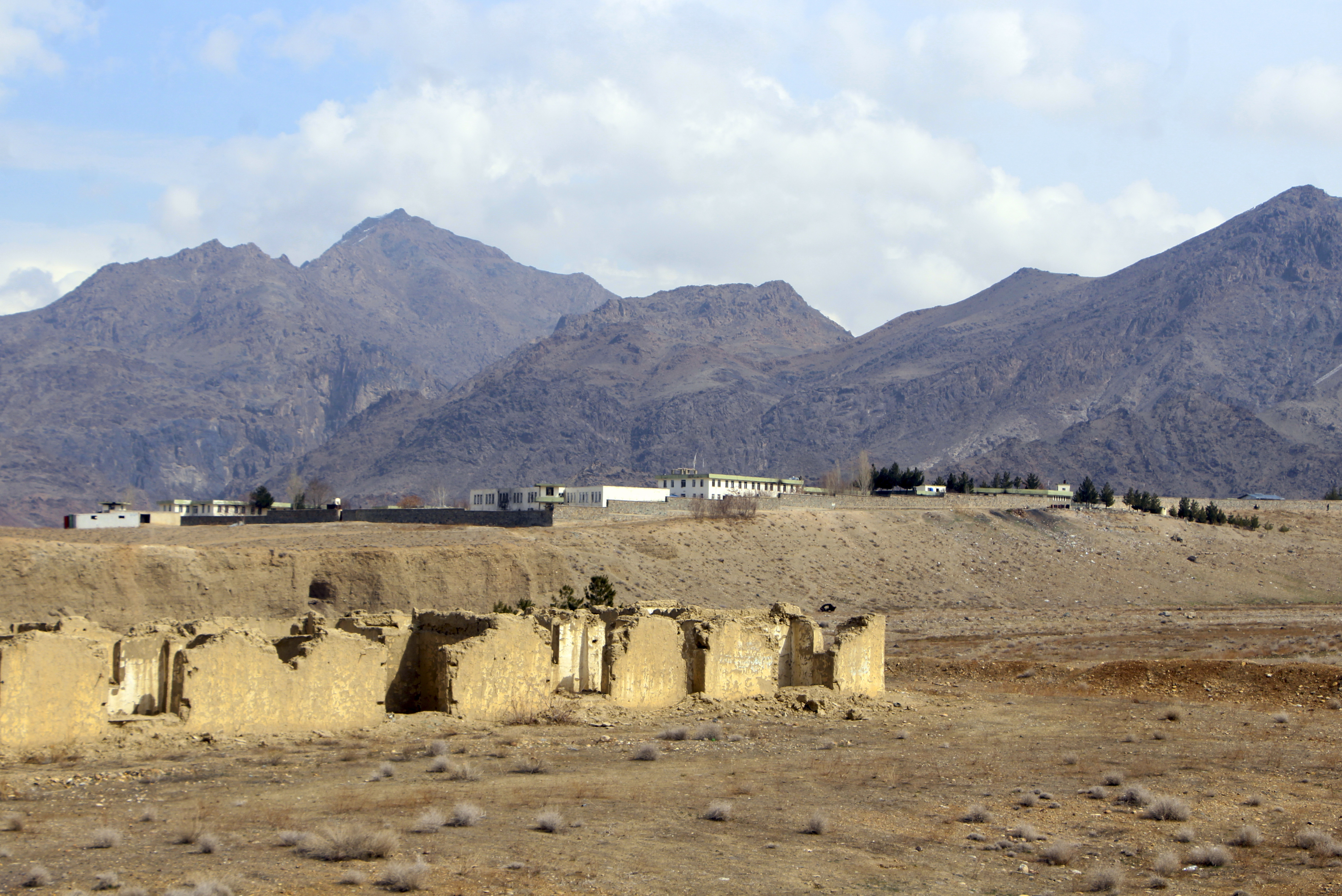 A general view of Mes Aynak valley is seen some 40 kilometers (25 miles) southwest of Kabul, Afghanistan, Wednesday, March 2, 2022. The valley is the world's second-largest unexploited copper estimated to be worth nearly $1 trillion. Buildings on top are offices of a Chinese mining company MCC that won the contract to exploit the mine over ten years ago. (AP Photo/Shafiullah Zwak)