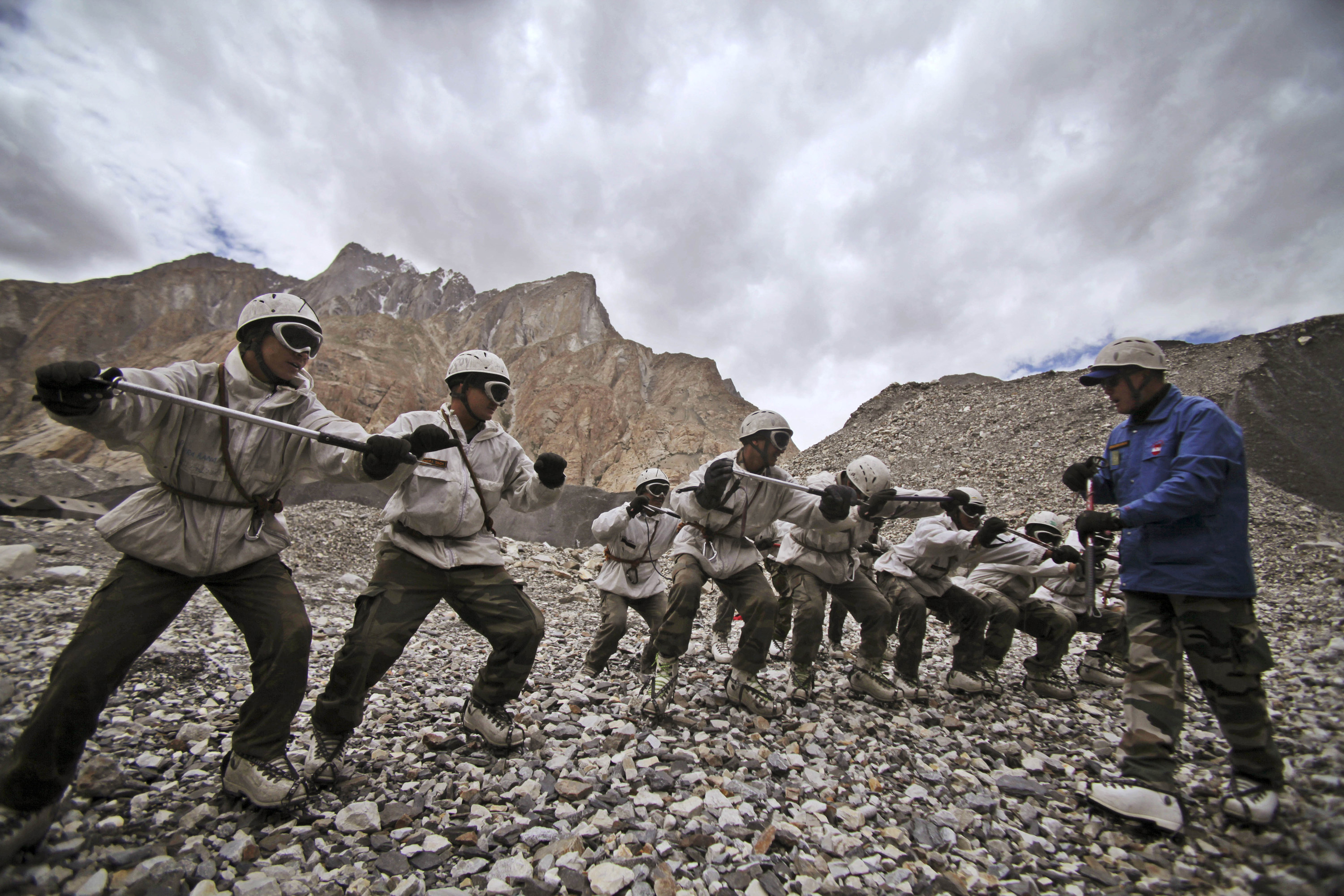 FILE- Indian army soldiers undergo a training session at the Siachen base camp, in Indian Kashmir on the border with Pakistan, July 19, 2011. The remains of an Indian army soldier have been found more than 38 years after he went missing on a glacier at the highest point along the heavily militarized disputed border between India and Pakistan in Kashmir, officials said Wednesday.