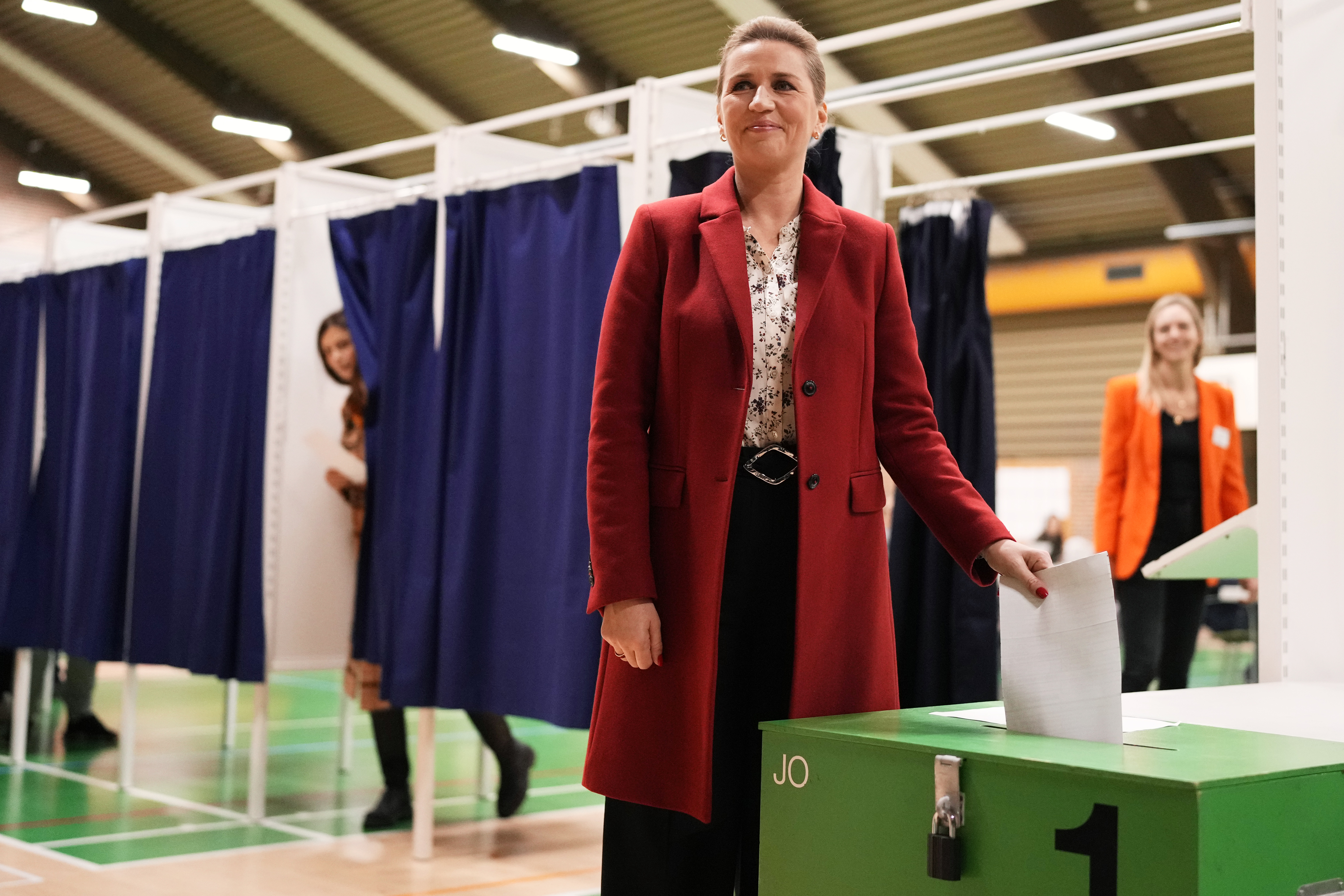 Danish Prime Minister Mette Frederiksen casts her ballot at a polling station in Hareskovhallen in Vaerloese