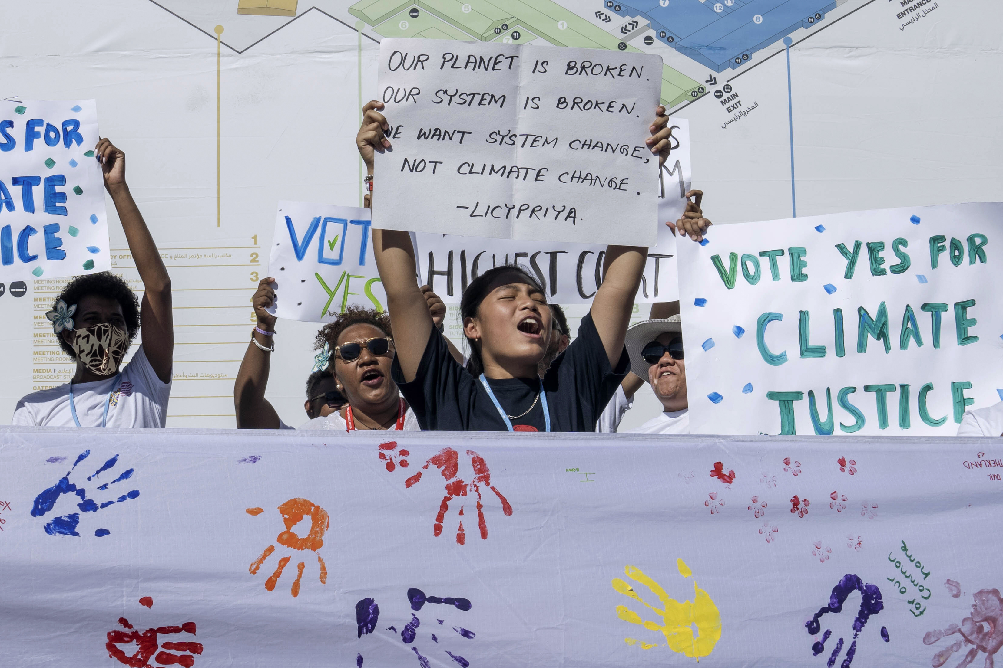 Members of the "Pacific Islands Students Fighting Climate Change" (PISFCC) organization stage a protest during the COP27 United Nations Climate Summit in Sharm el-Sheikh, Egypt, Thursday, Nov. 10, 2022. (AP Photo/Nariman El-Mofty)