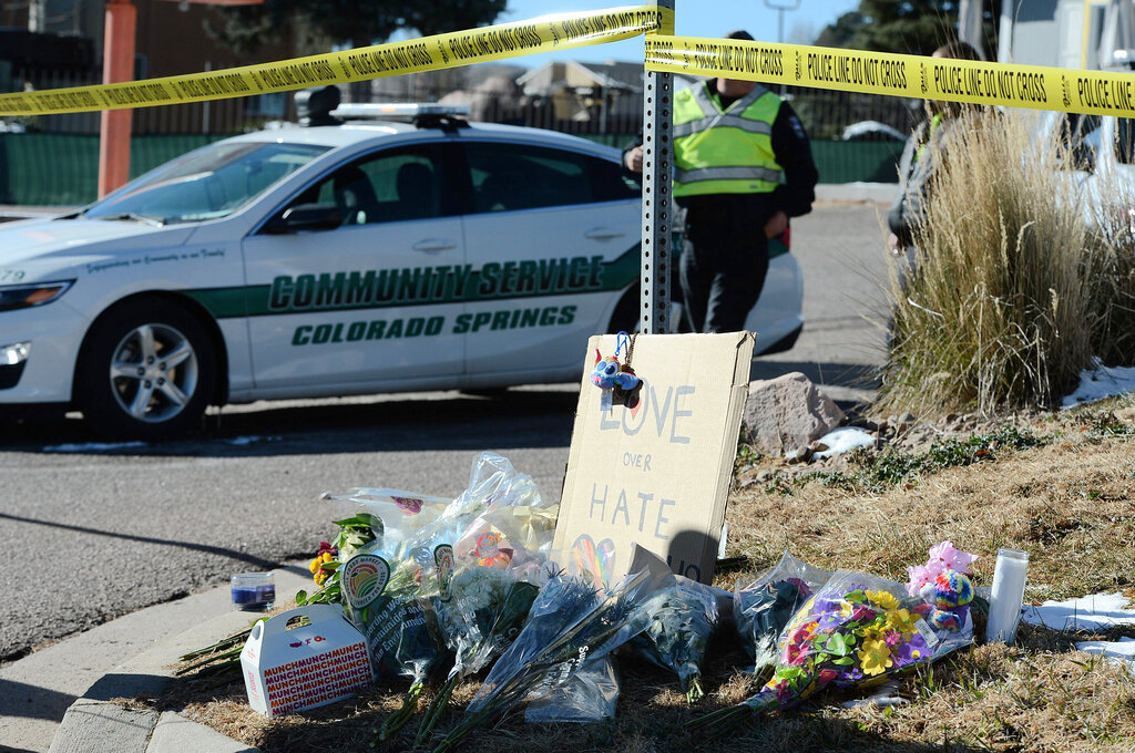 Flowers and a sign reading "love over hate" lay near a gay nightclub where a shooting occurred late Saturday night in Colorado Springs, Colorado.
