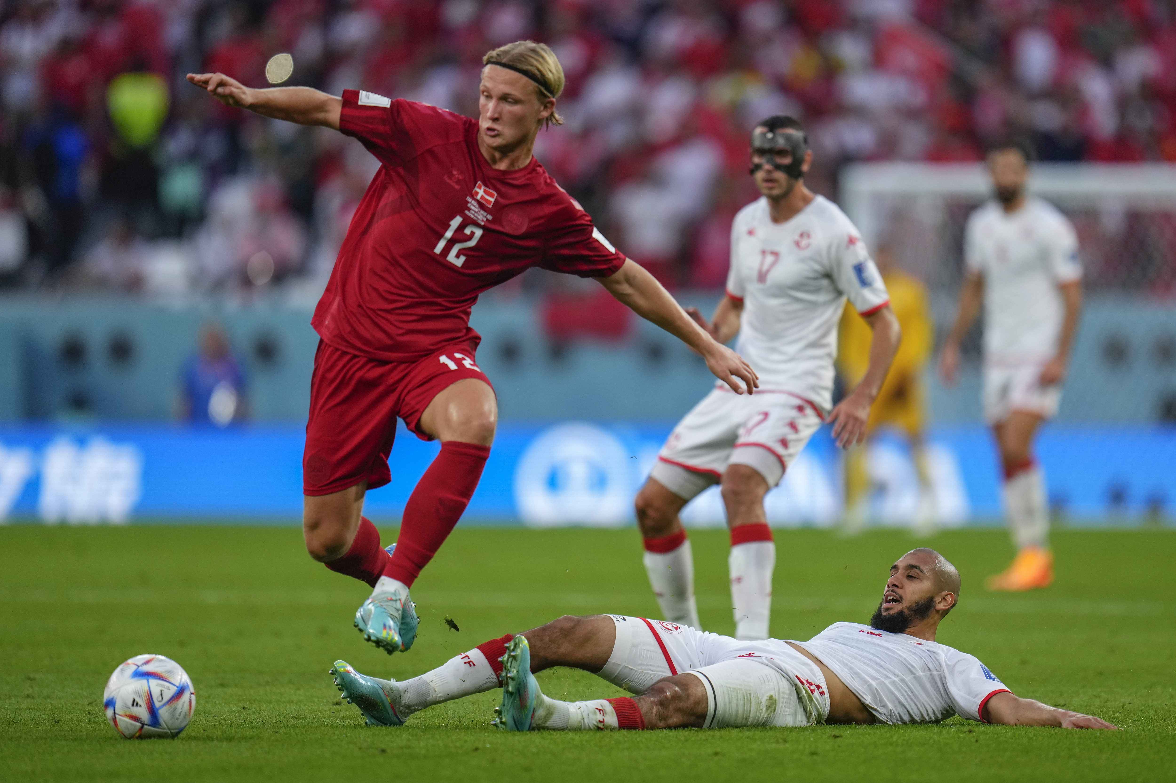 Denmark's Kasper Dolberg, left, vies for the ball with Tunisia's Aissa Laidouni during their match.